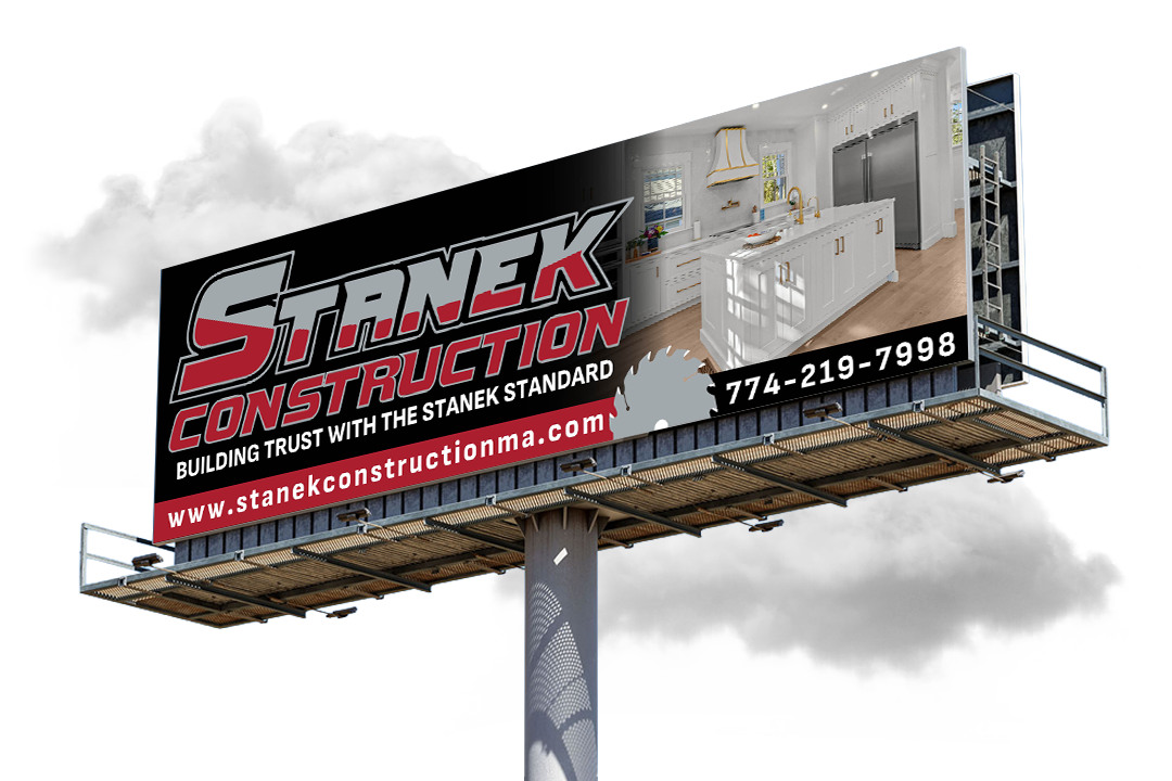 Billboard advertisement for Stanek Construction showing a kitchen renovation and contact details.