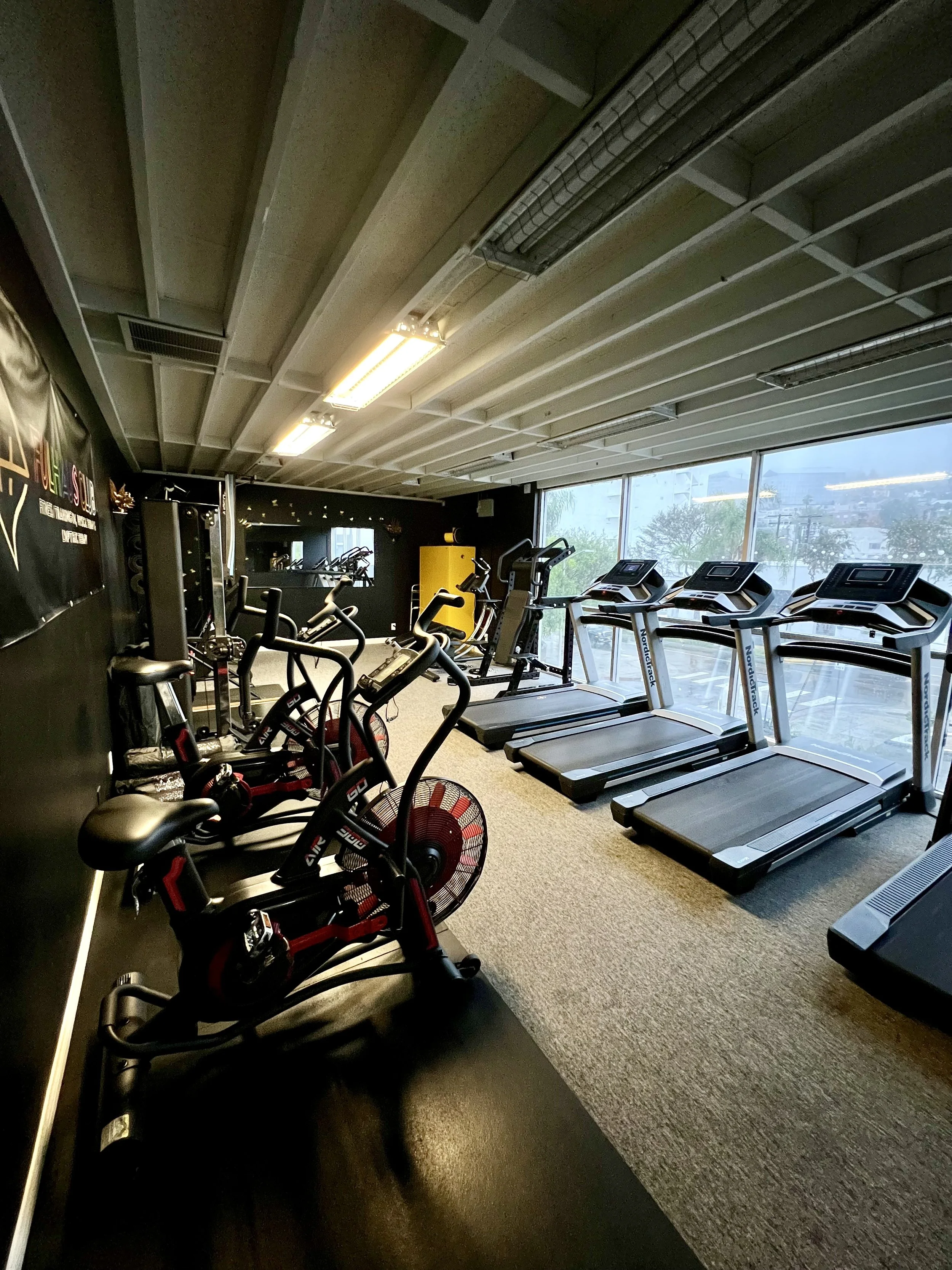 The cardio training area at FulHaus Club offers treadmills, air bikes, and conditioning equipment for warm-ups, endurance training, and recovery sessions. Located inside our private gym in West Hollywood, this space allows members to build cardiovasc