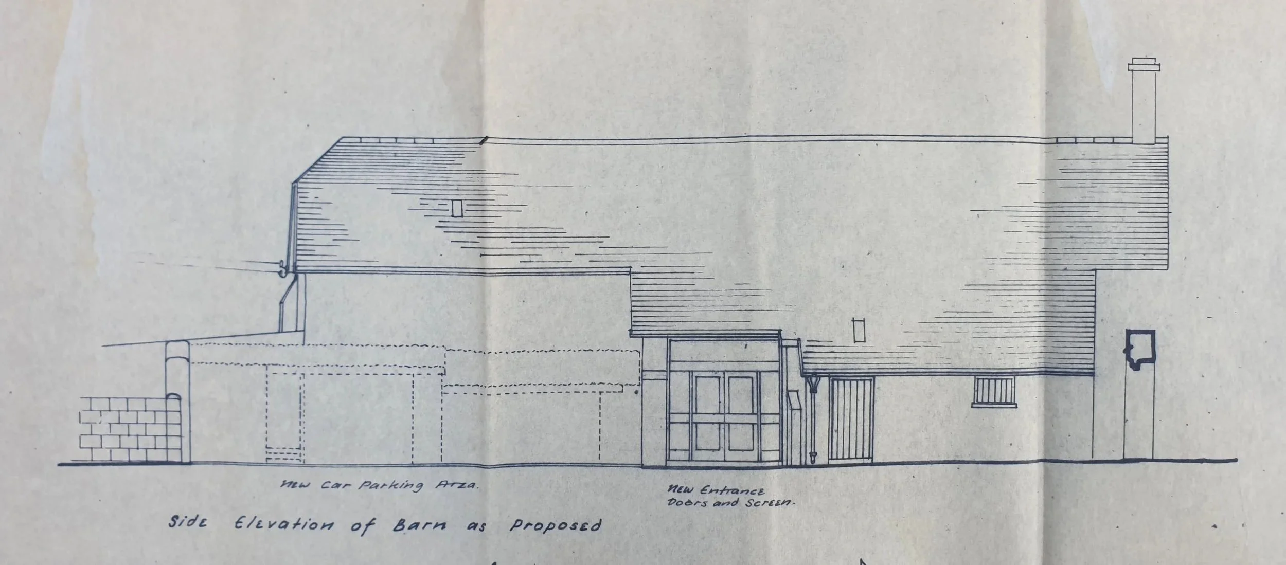 Architectural drawing by John Rees-Jowett showing a proposed barn conversion with new car parking area and entrance doors.