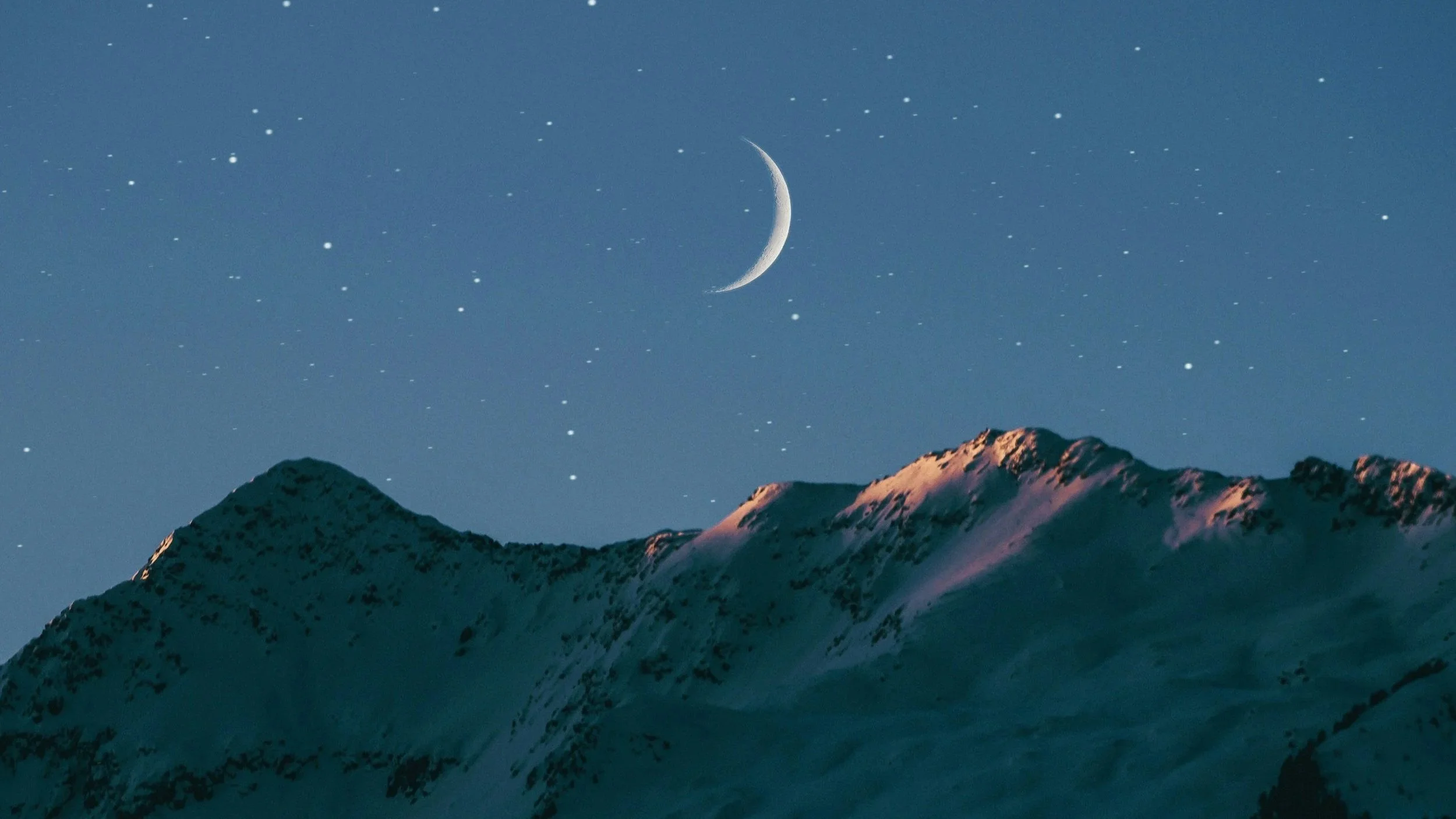 new moon over mountain night sky