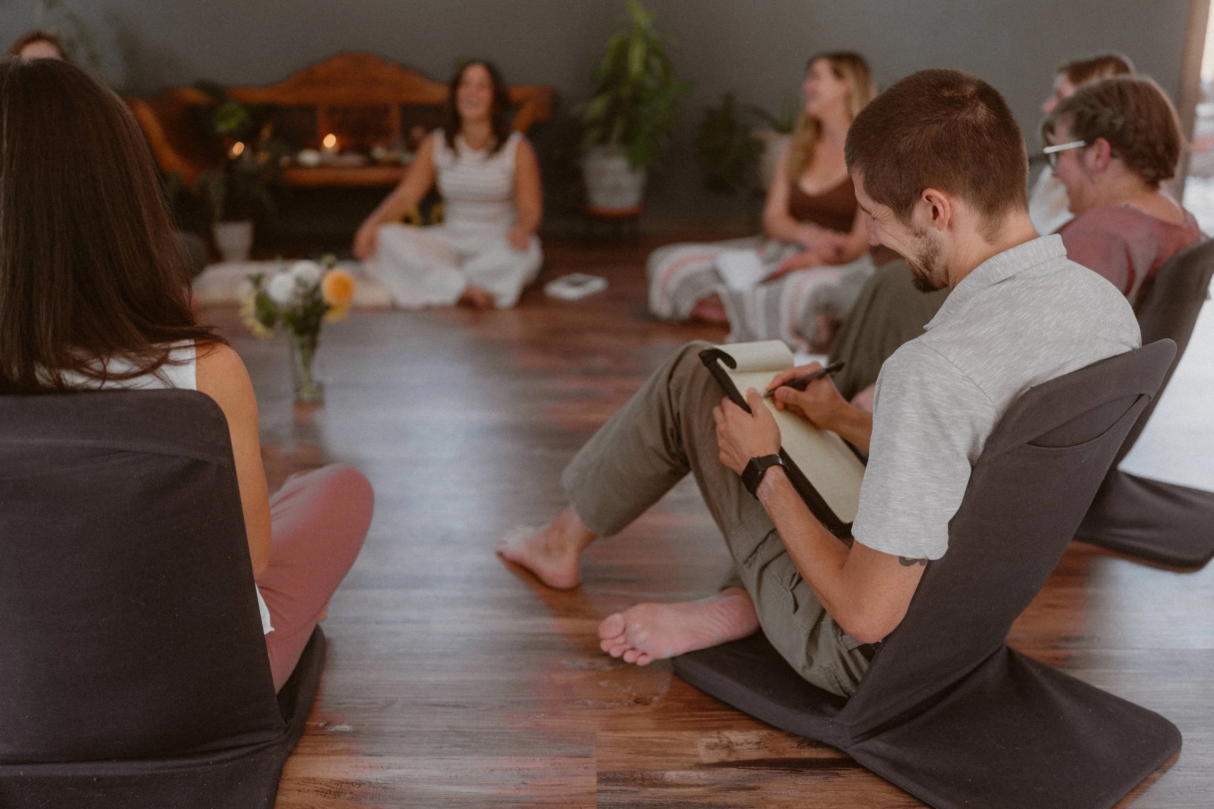 Mist rising above pine trees.