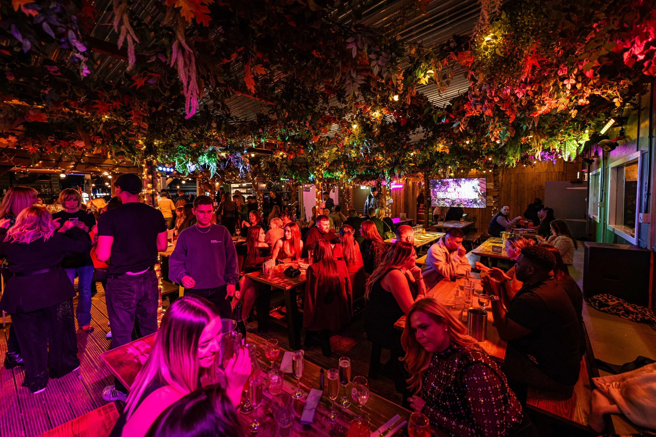 Guests celebrating Christmas in the Pergola at The Lawn Club Manchester