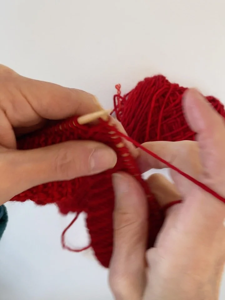 Any red hat is a red hat! AND there are free patterns available. AND this particular pattern raises funds for those impacted by ICE. 
From their website:
All proceeds from the sale of this pattern go to the immigrant aid agencies who will distribute 