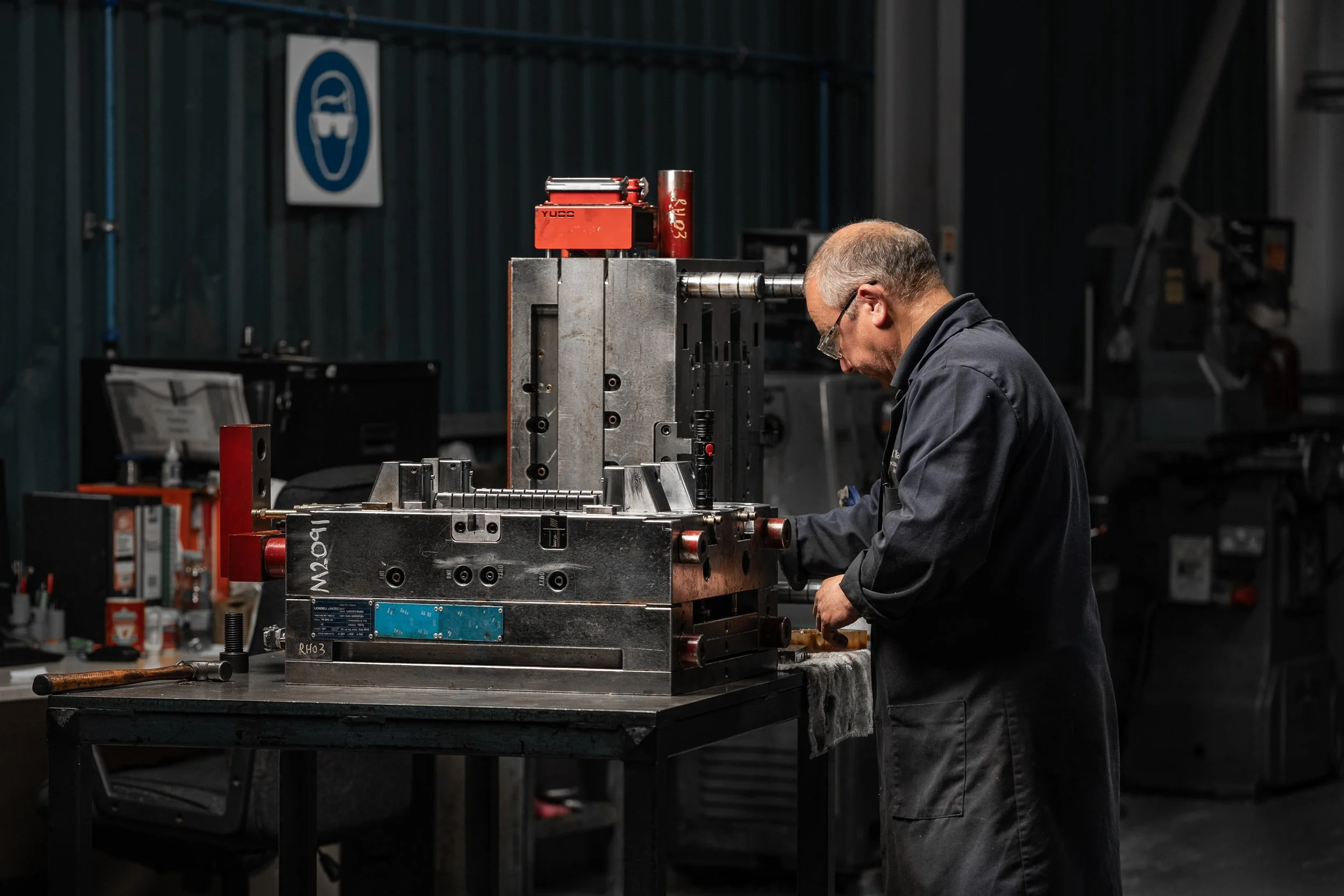 Industrial engineer operating machinery in manufacturing facility Lancashire