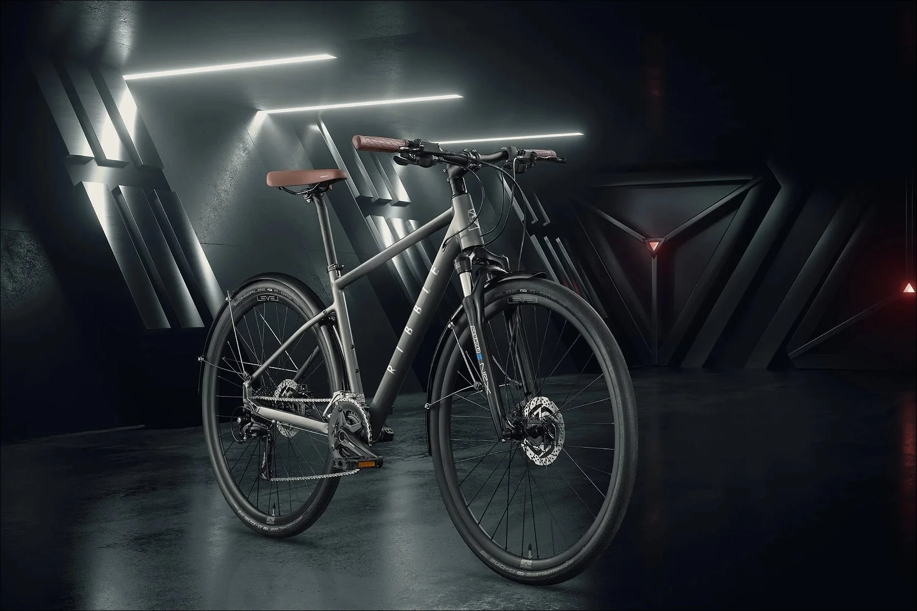Silver performance bicycle photographed in a futuristic dark studio with neon lights.