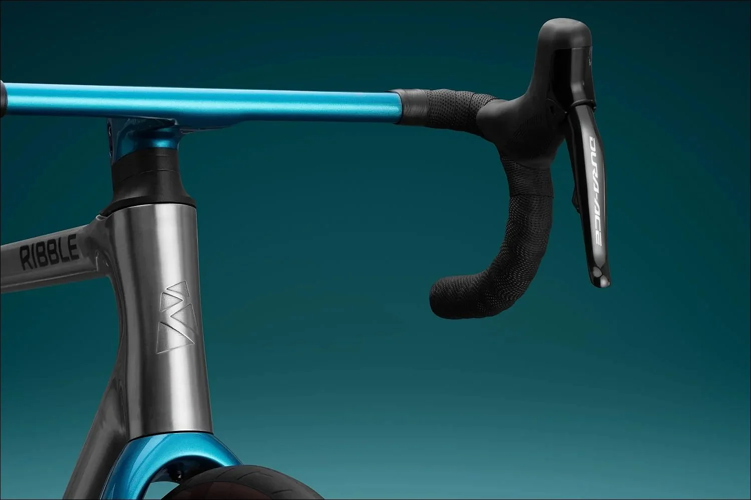 Close-up of a teal bicycle handlebar and stem with visible brake levers against a teal gradient background.