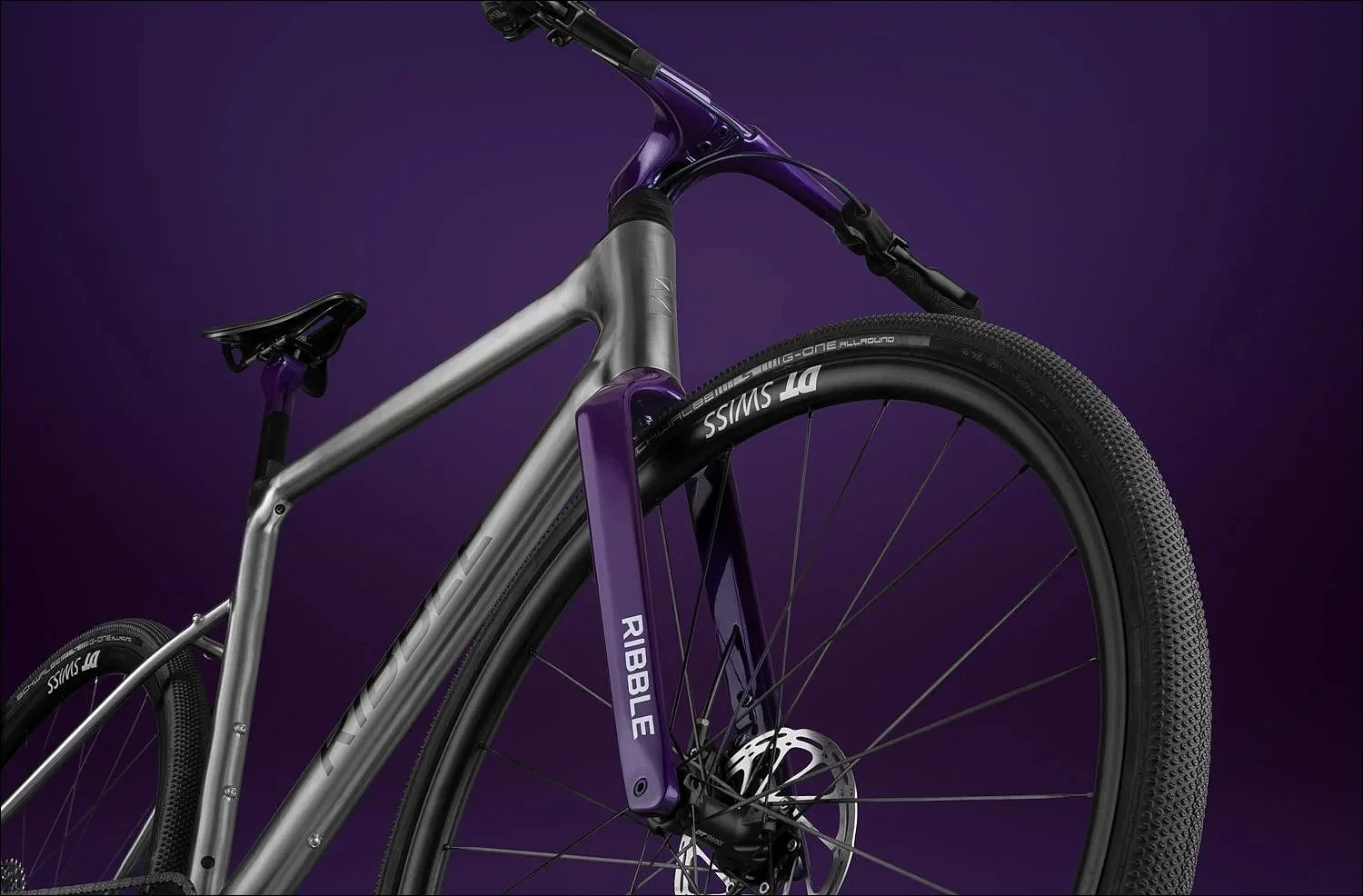 Grey and purple  bike product photograph on a dark purple background