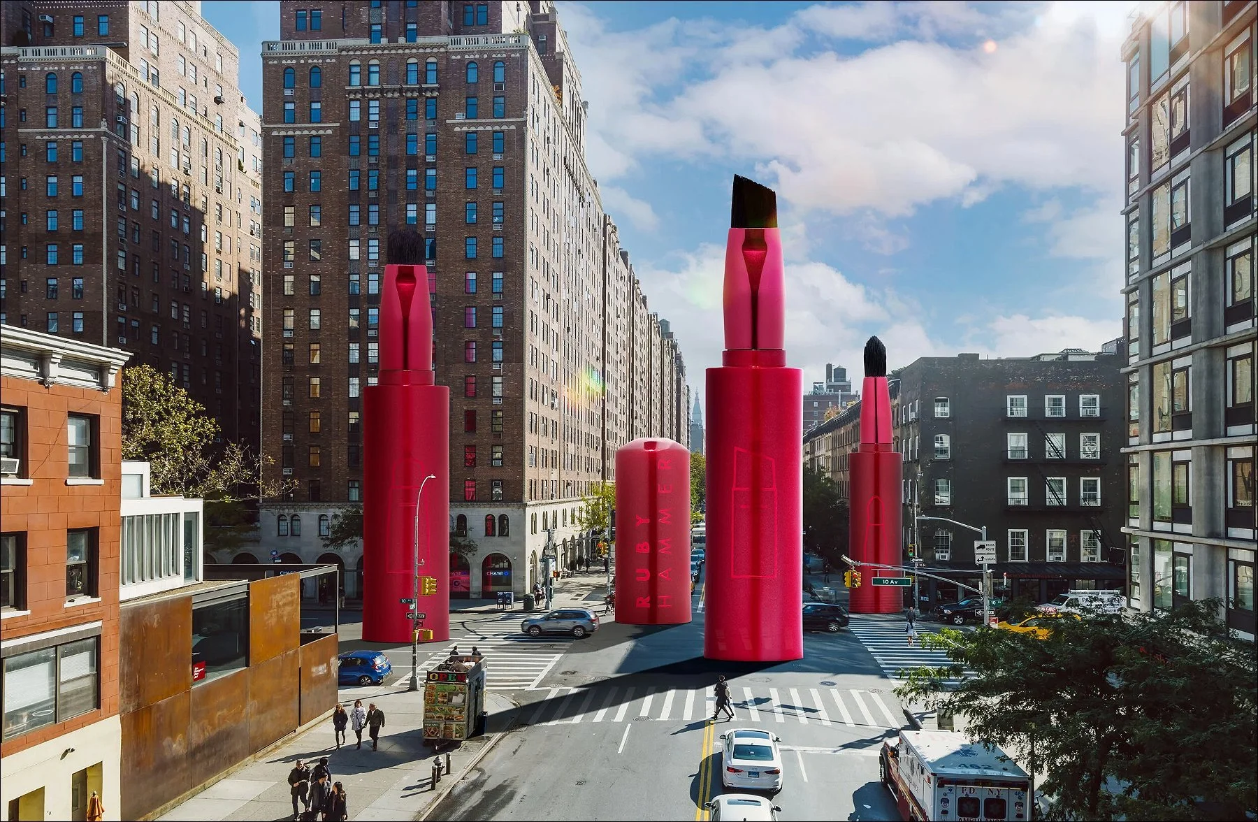 Urban city square with tall red cylindrical sculptures among surrounding buildings under a blue sky