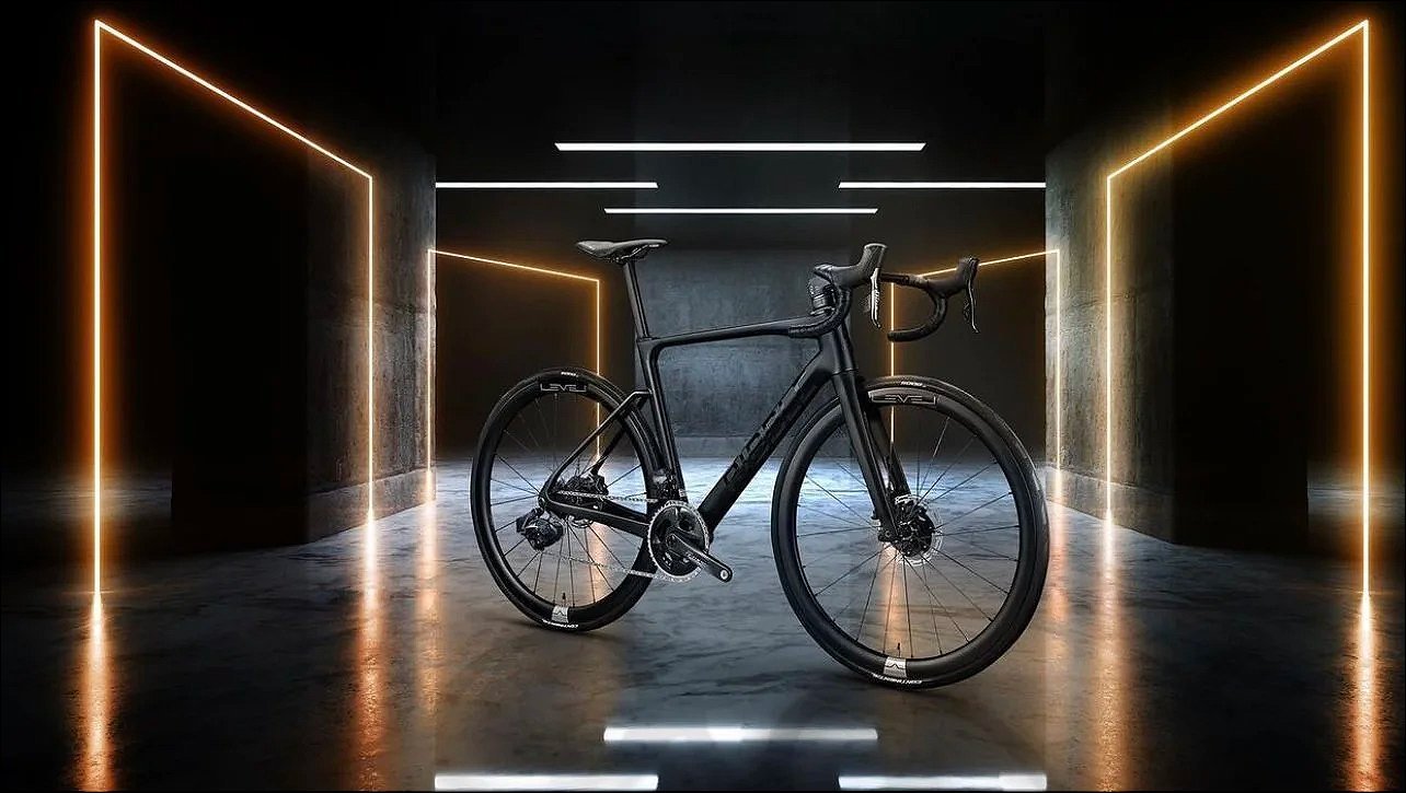 Bicycle displayed in a futuristic illuminated room with vertical golden light bars.