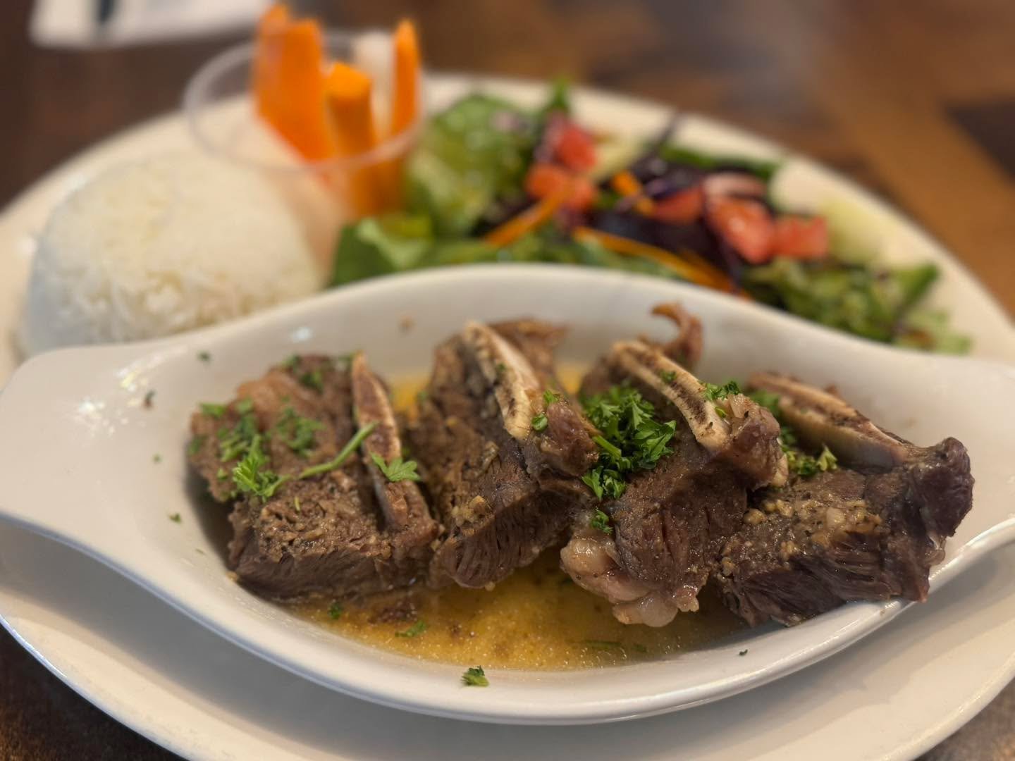 Ed made one of his favourite fusion dishes for lunch today.  Marinated Black Pepper Beef Short Ribs.  Served with fusion salad.  jasmine rice and pickled daikon and carrots. 

Available 11-2 pm while supplies lasts.