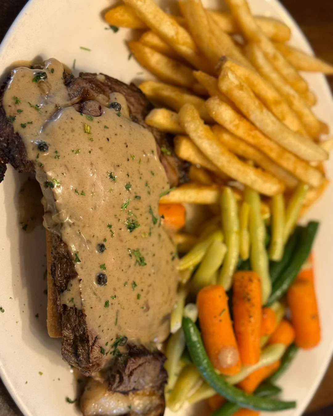 Bourbon peppercorn Prime Rib on our lunch Feature Monday! 

On a garlic baguette with veggies and fries.