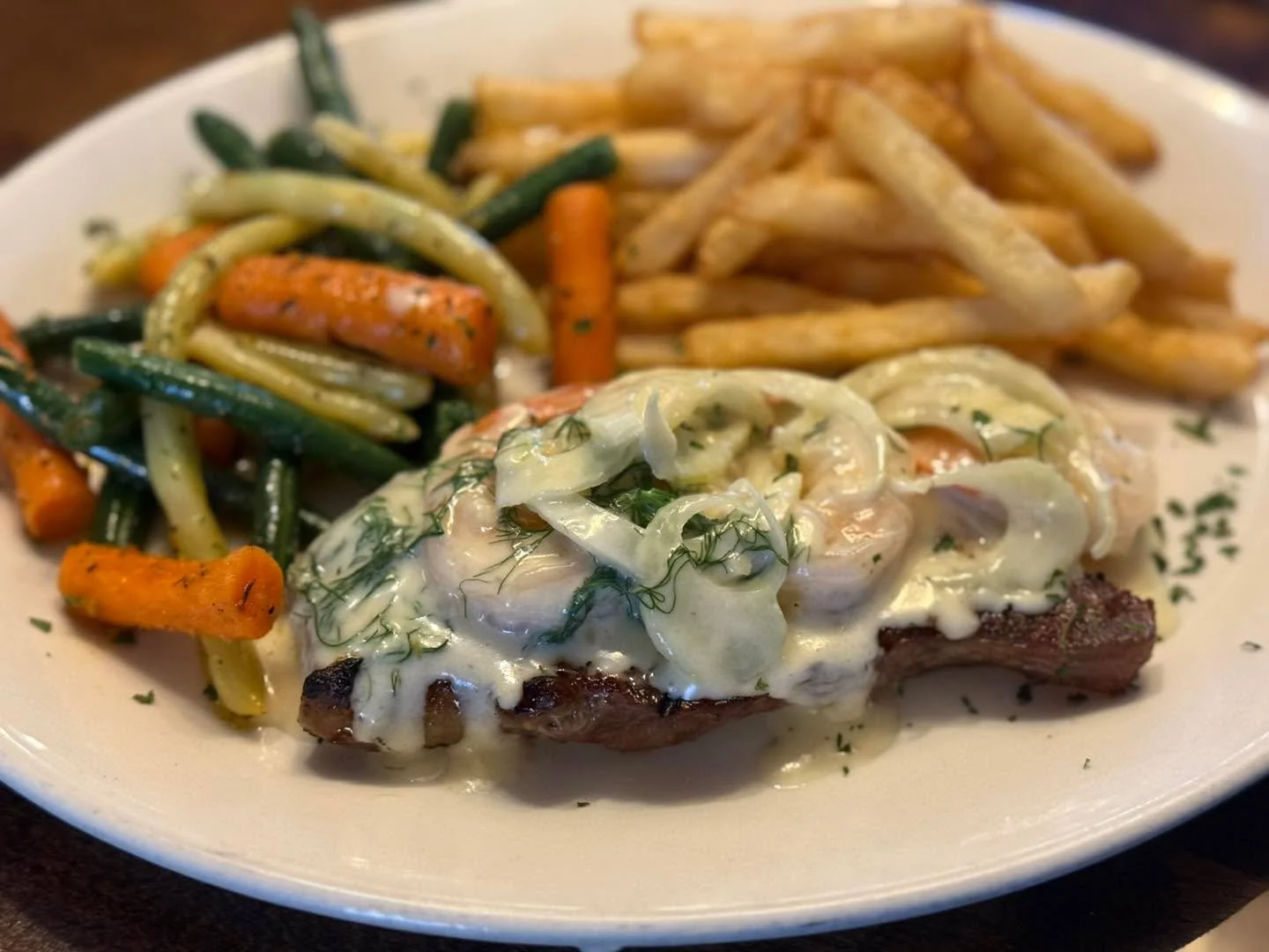 Surf &amp; Turf Lunch at Coyotes! 

Featured is our Sambuca Prawns with New York Strip. 

Fresh Fennel and Deglazing the prawns with Sambuca creates this amazing flavouring.