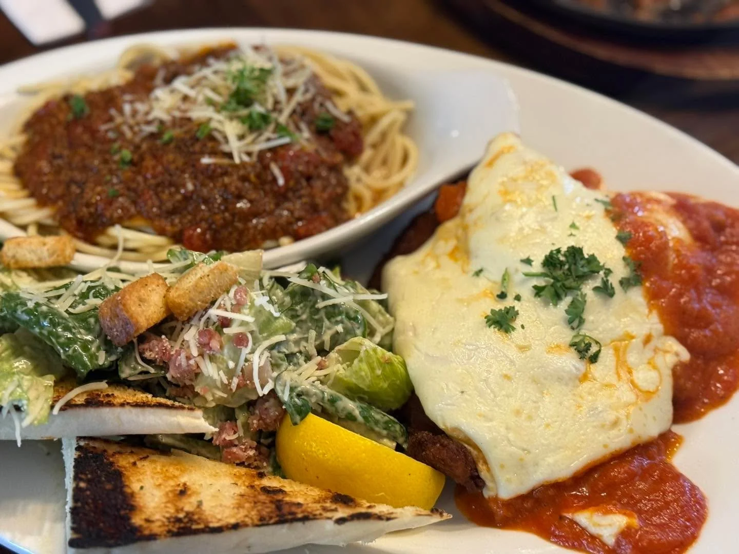 Our Spectacular Chicken Parmesan Slide! 

Served with Caesar salad and Ed&rsquo;s Spaghetti.