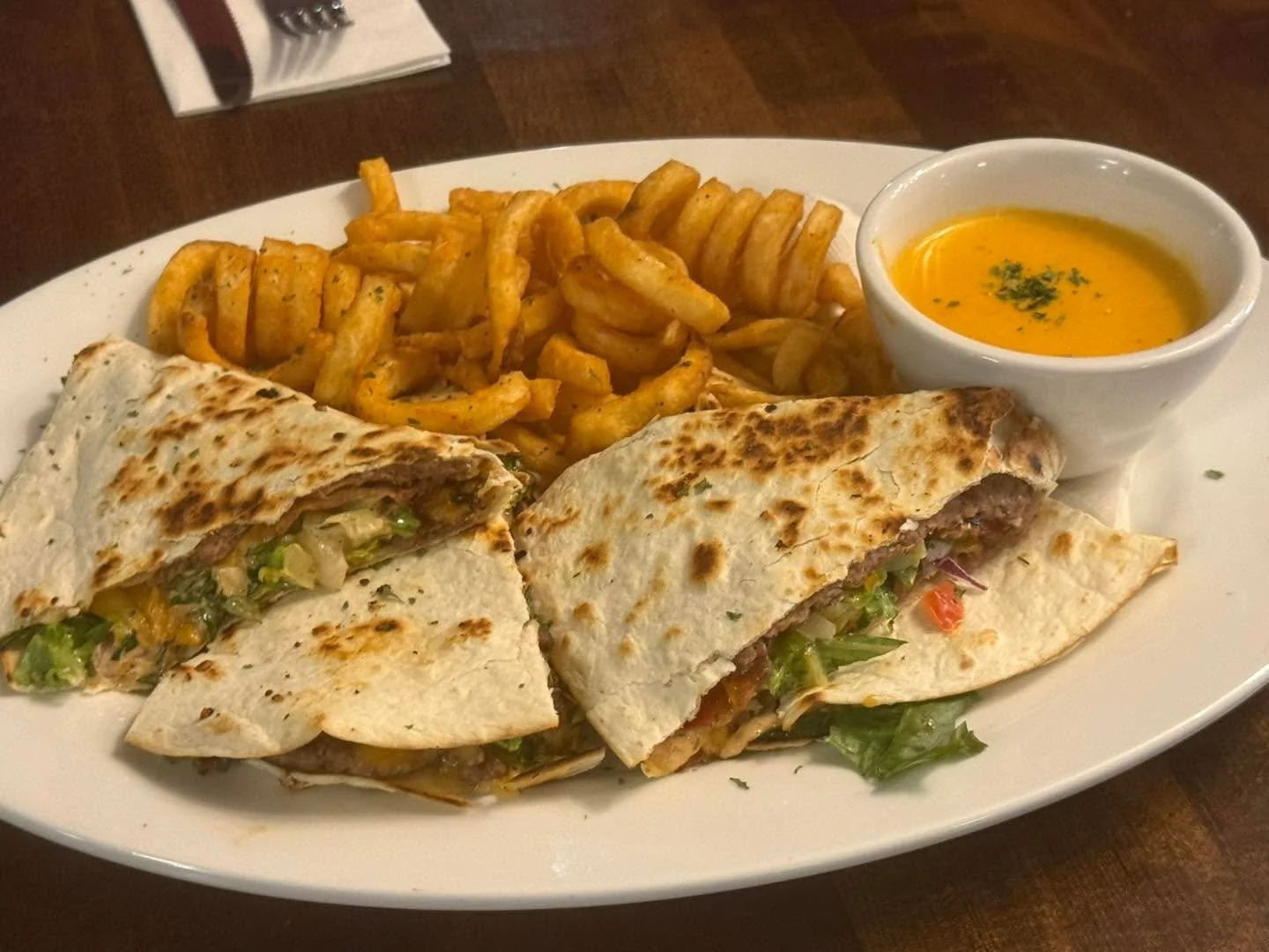 On our Lunch Feature!  We have a Bacon Cheeseburger Quesadilla!  Served with Cajun Curley Fries! 

Available 11-2 pm.