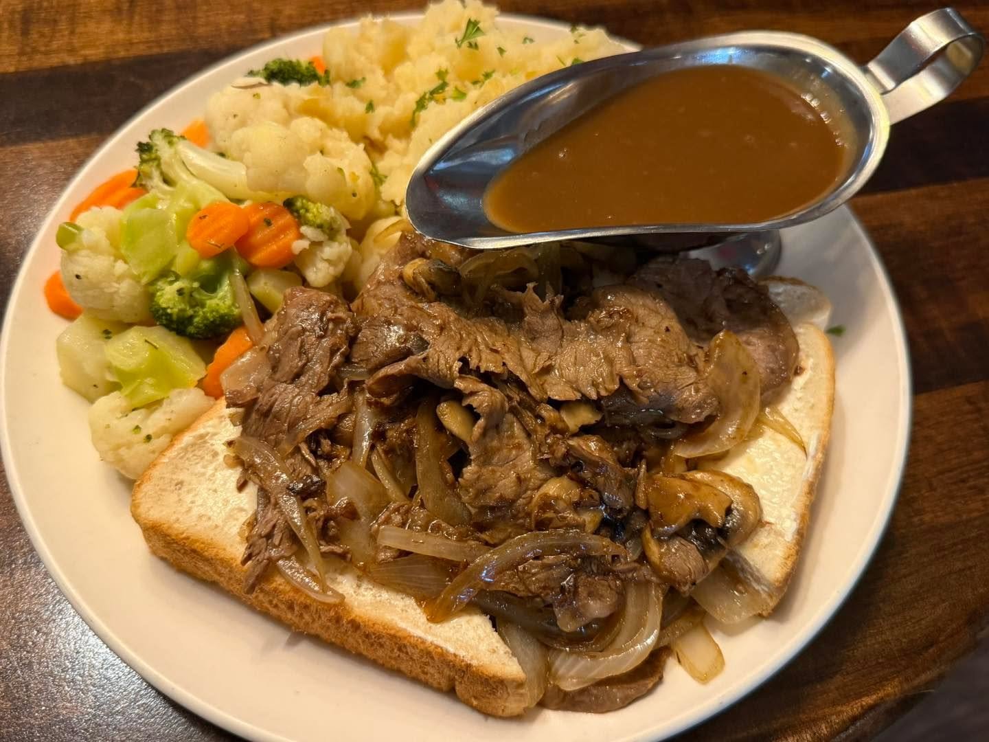 Roast Beef Supreme!  On our Epic Lunch Menu! 

Half a pound of fresh Shaved Certified Angus Ribeye saut&eacute;ed with onions and mushrooms.  Over Fresh Texas Bread and Drizzled with Coyotes Fresh Beef Gravy table-side. 

Served with Veggies and Mash