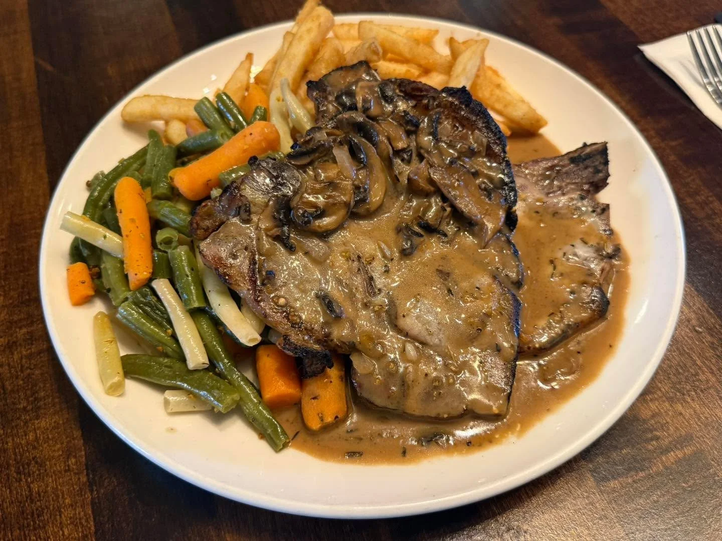 Chargrilled pork chops with a mushroom sauce! 

Available 11-2 pm for Lunch!