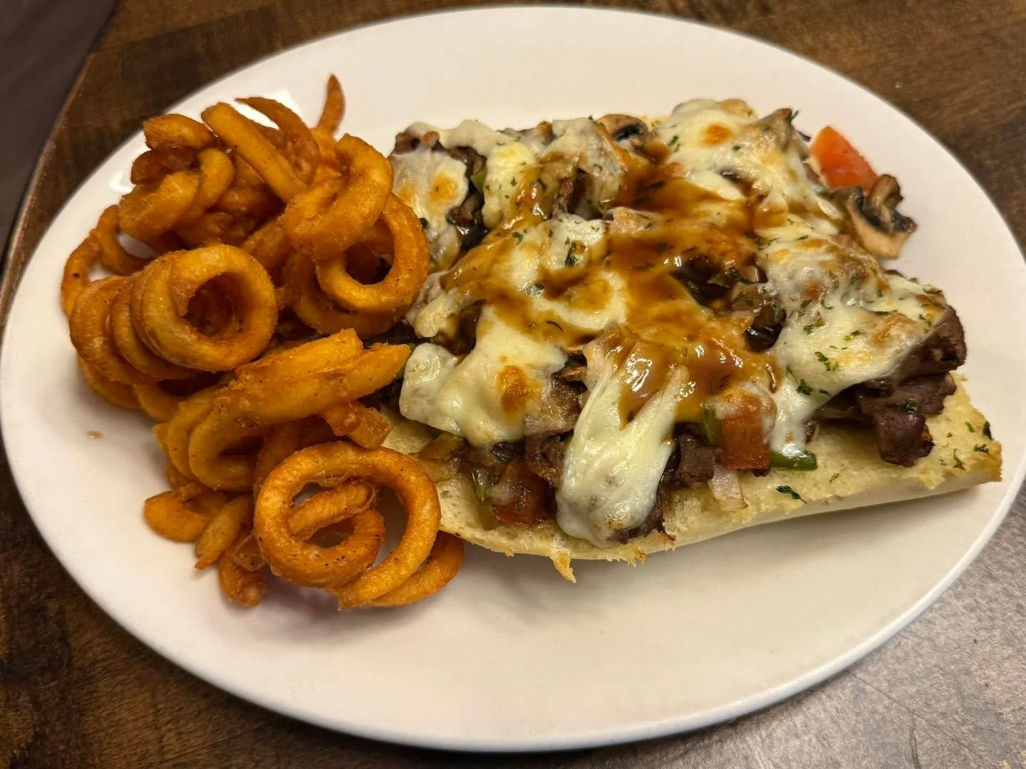 For you Tasting Pleasure.  We have an open faced Philly Cheesesteak with Provolone cheese.  Served with Cajun Curley Fries! 

Available 11-2 pm. 

Come Get Some!