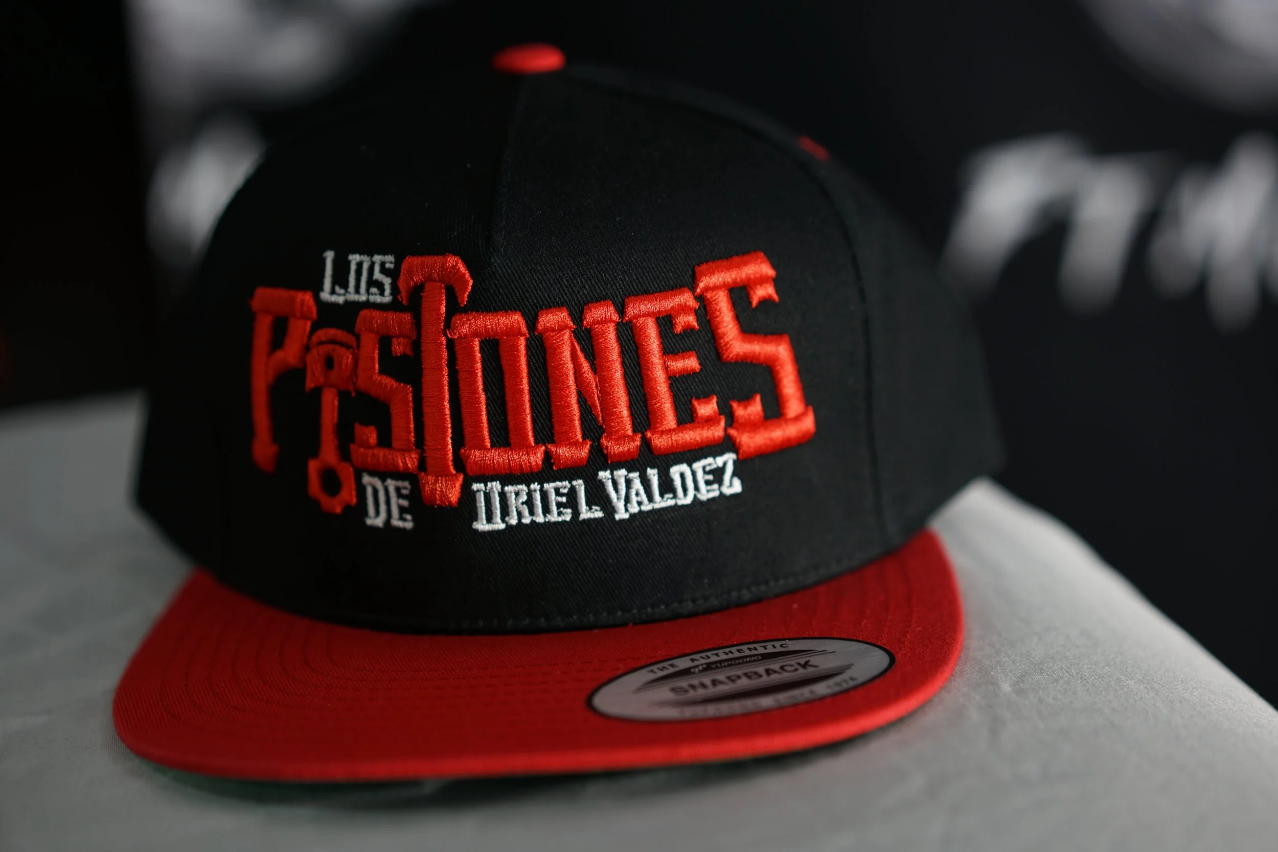 Los Pistones De Uriel Valdez Cap (Red & Black)