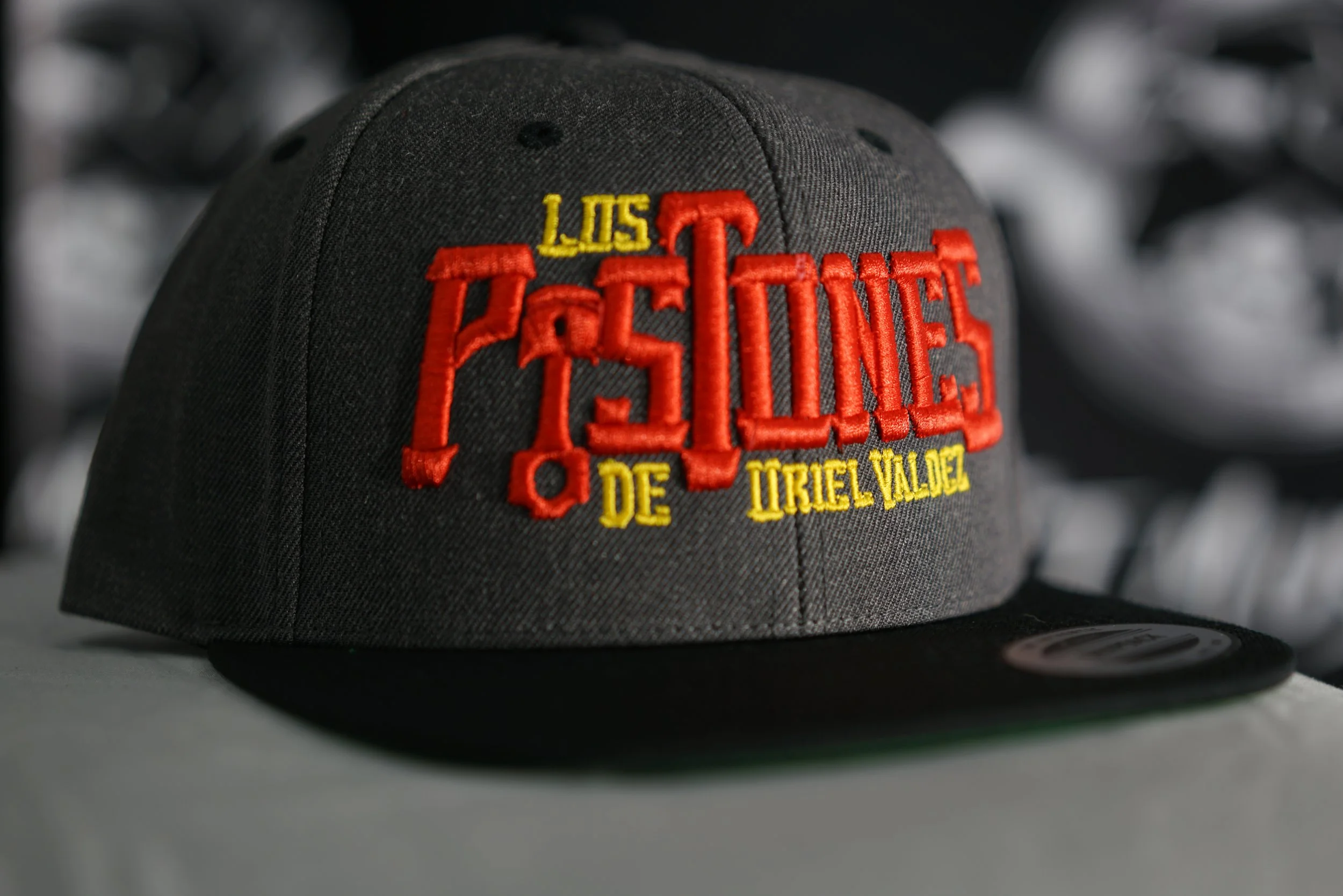 Los Pistones De Uriel Valdez Cap (Red, Yellow & Multicolor).