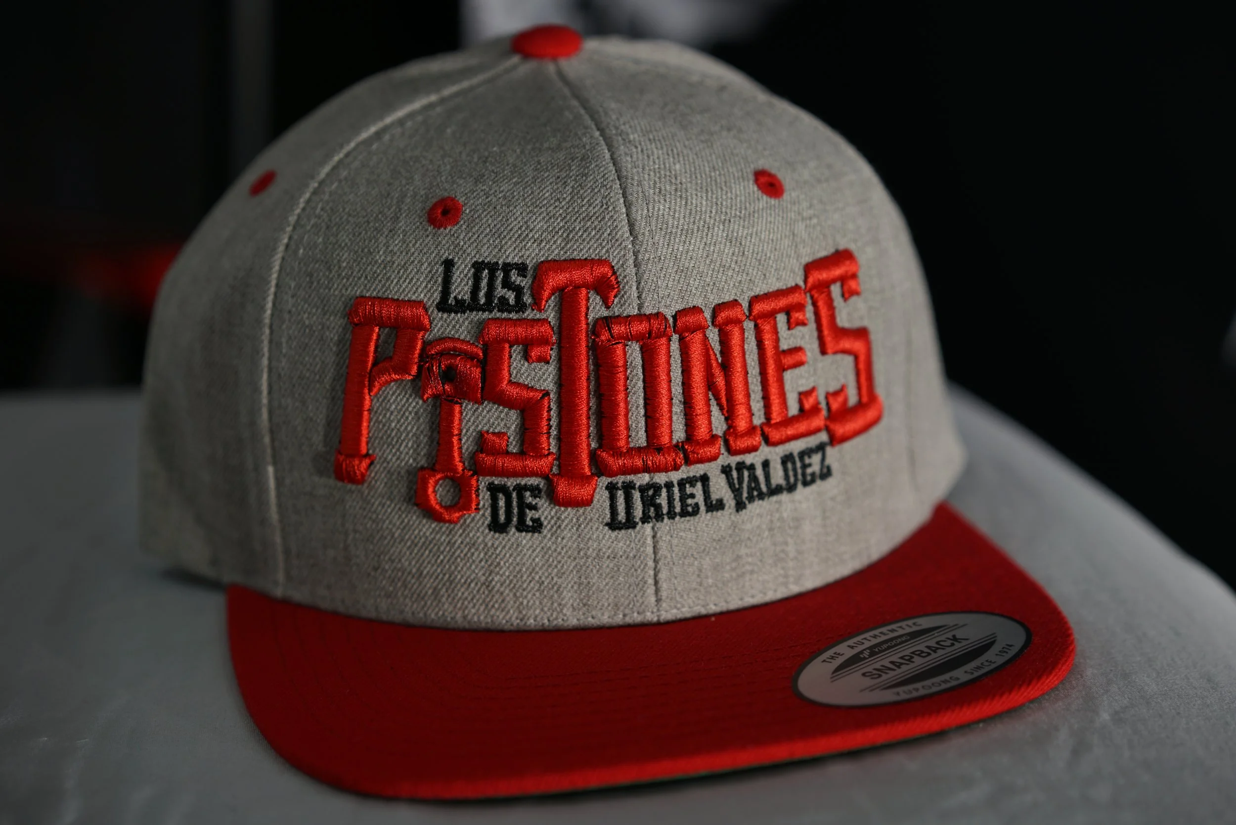 Los Pistones De Uriel Valdez Cap (Red & Grey).