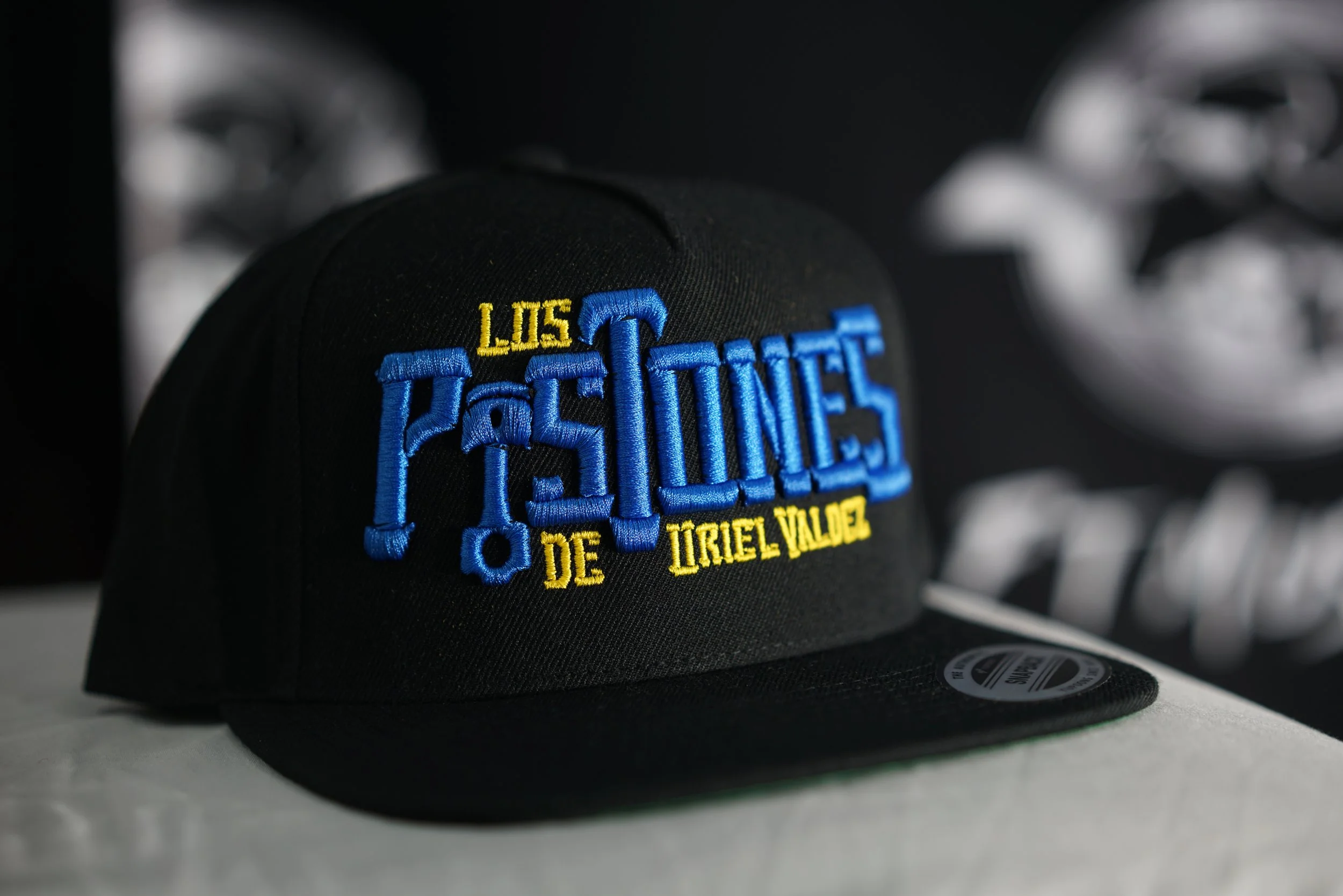 Los Pistones De Uriel Valdez Cap (Blue, Yellow & Black).