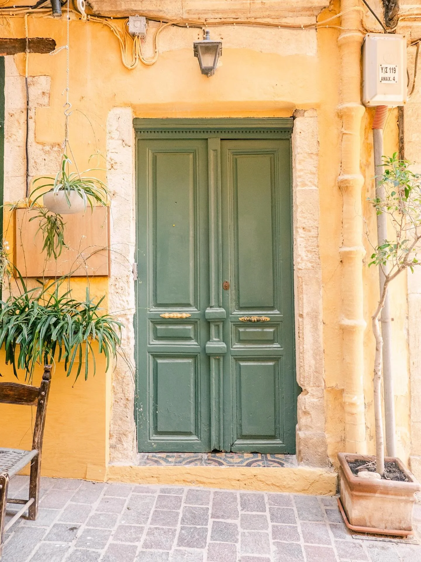 Chania 🇬🇷 &bull;&bull; This door was so cute - done in colors I love but could never execute myself. It was one of many in the charming alleys of Chania. 

I told myself not to rush into working on my photos this trip, and I&rsquo;m finding I enjoy
