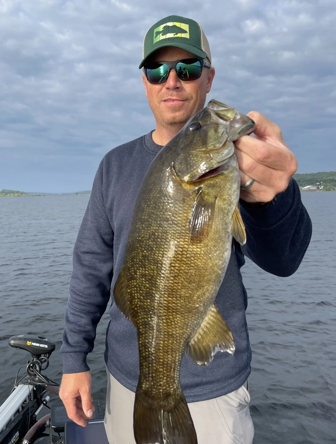 Bass Fishing Guide Services - Fishing Guide - Houghton, MI - Man holding a largemouth bass