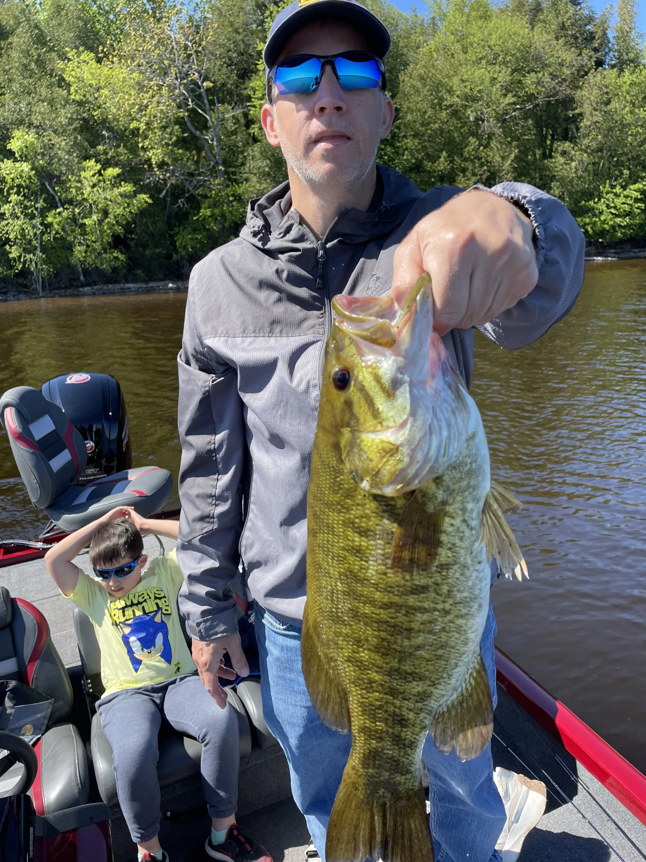 Bass Fishing Guide Services - Fishing Guide - Upper Michigan - Holding a Bass