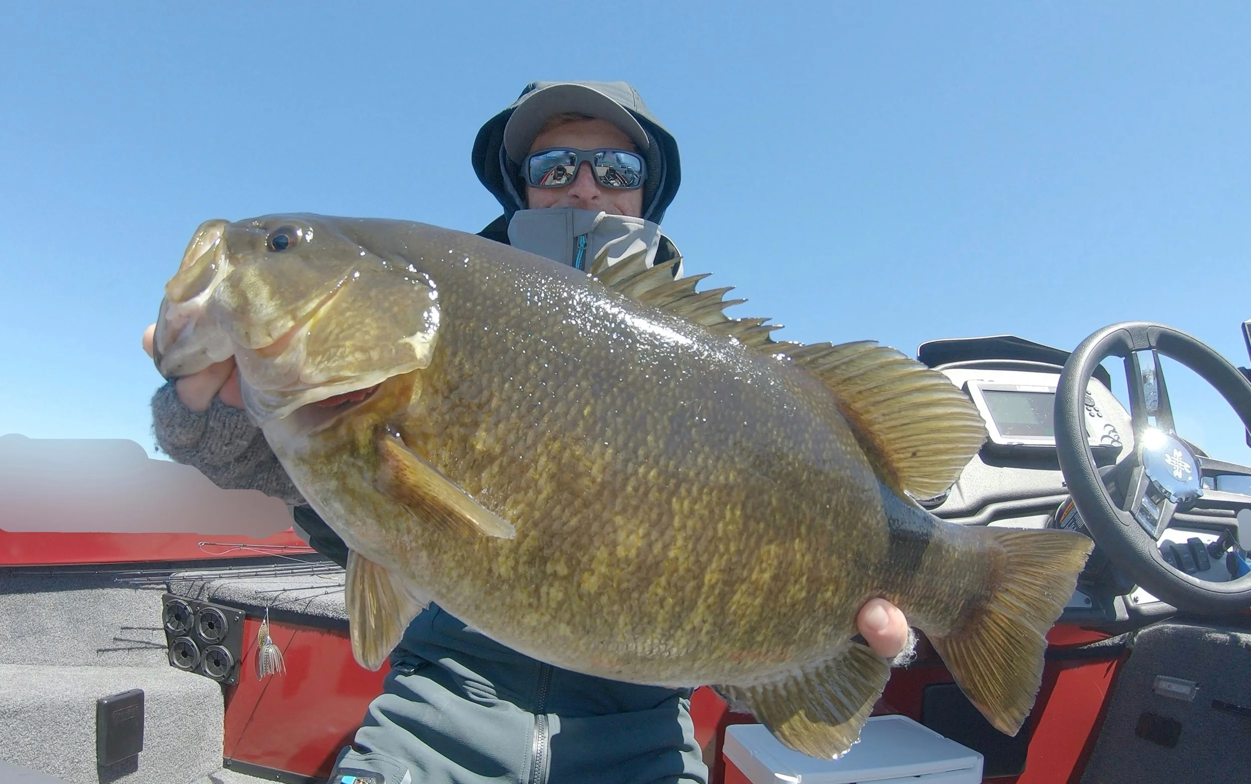 Bass Fishing Guide Services - Fishing Guide - Calumet, MI - Person holding a large fish