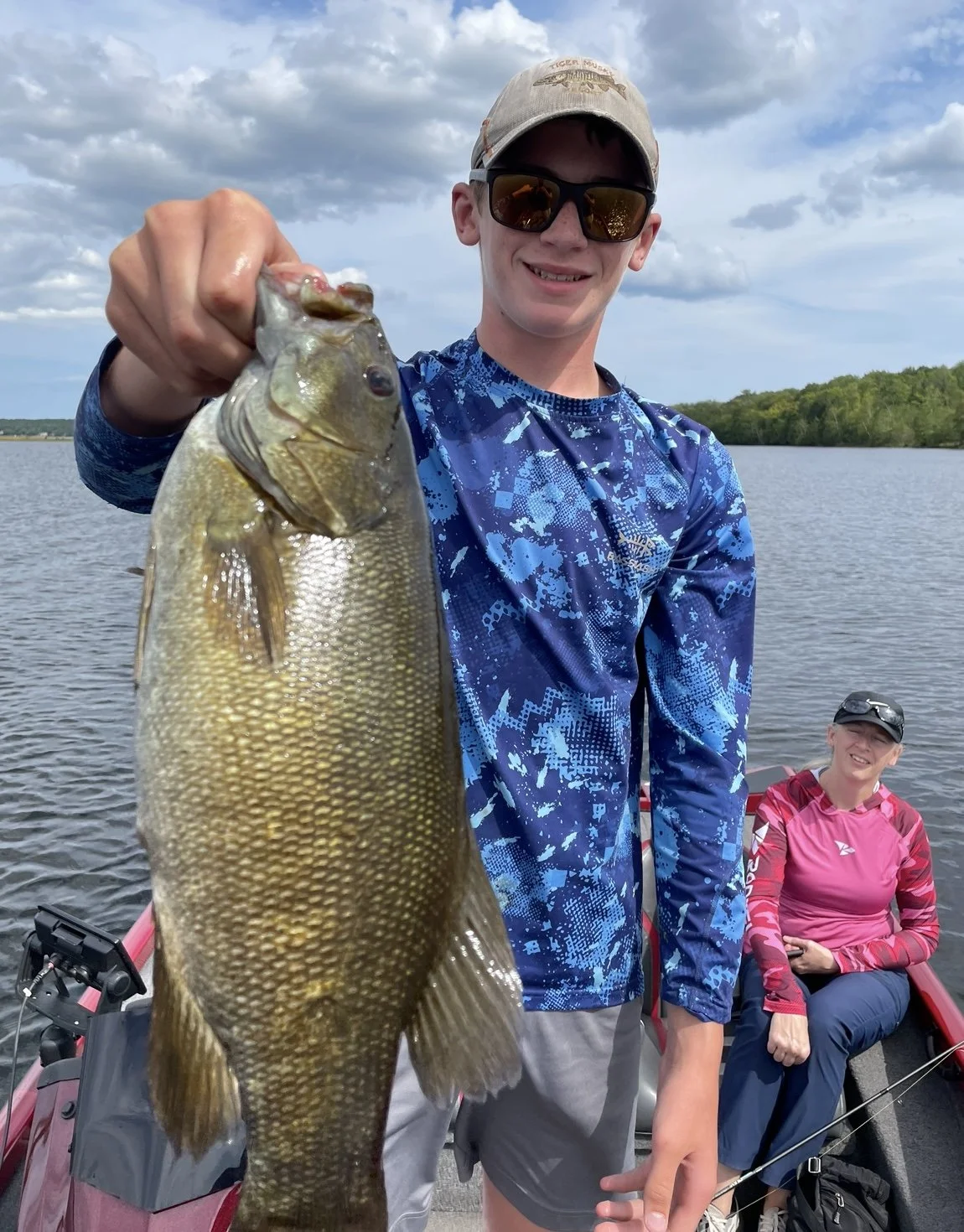 Bass Fishing Guide Services - Fishing Guide - Chassell, MI - Person holding a largemouth bass
