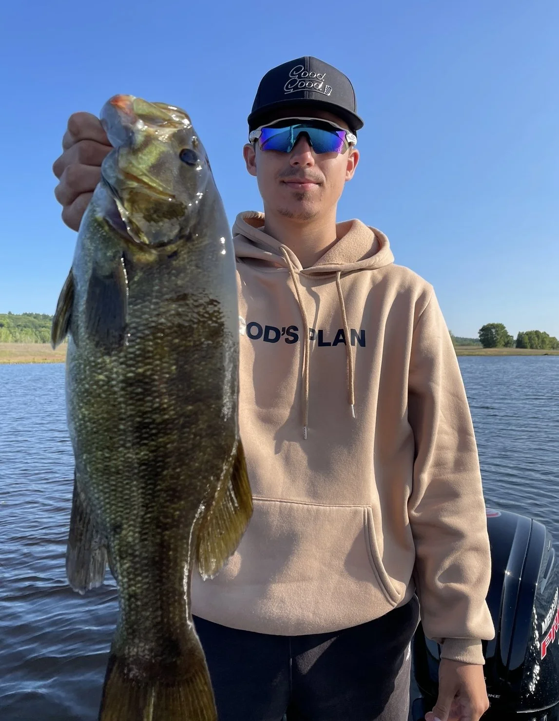 Bass Fishing Guide Services - Fishing Guide - Baraga, MI - Person holding a largemouth bass