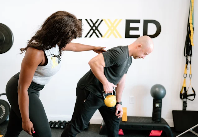 Patient working with a provider at a performance physical therapy clinic in Wakefield, MA