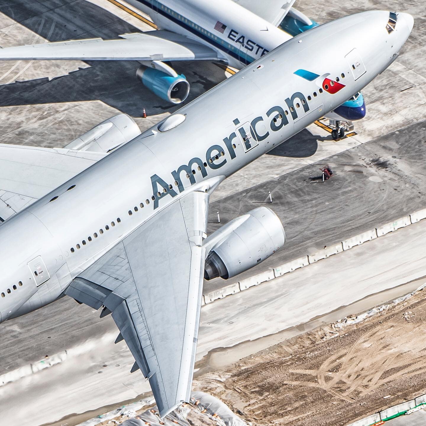 An American 777 rocketing out of Miami with an Eastern 767 in the background. #americanairlines #boeing777 #boeing #boeinglovers #miami #iflymia #miamiairport #a2a #aerialphotography #aviation #instagramaviation #avgeek #aviationphotography #nikon #d