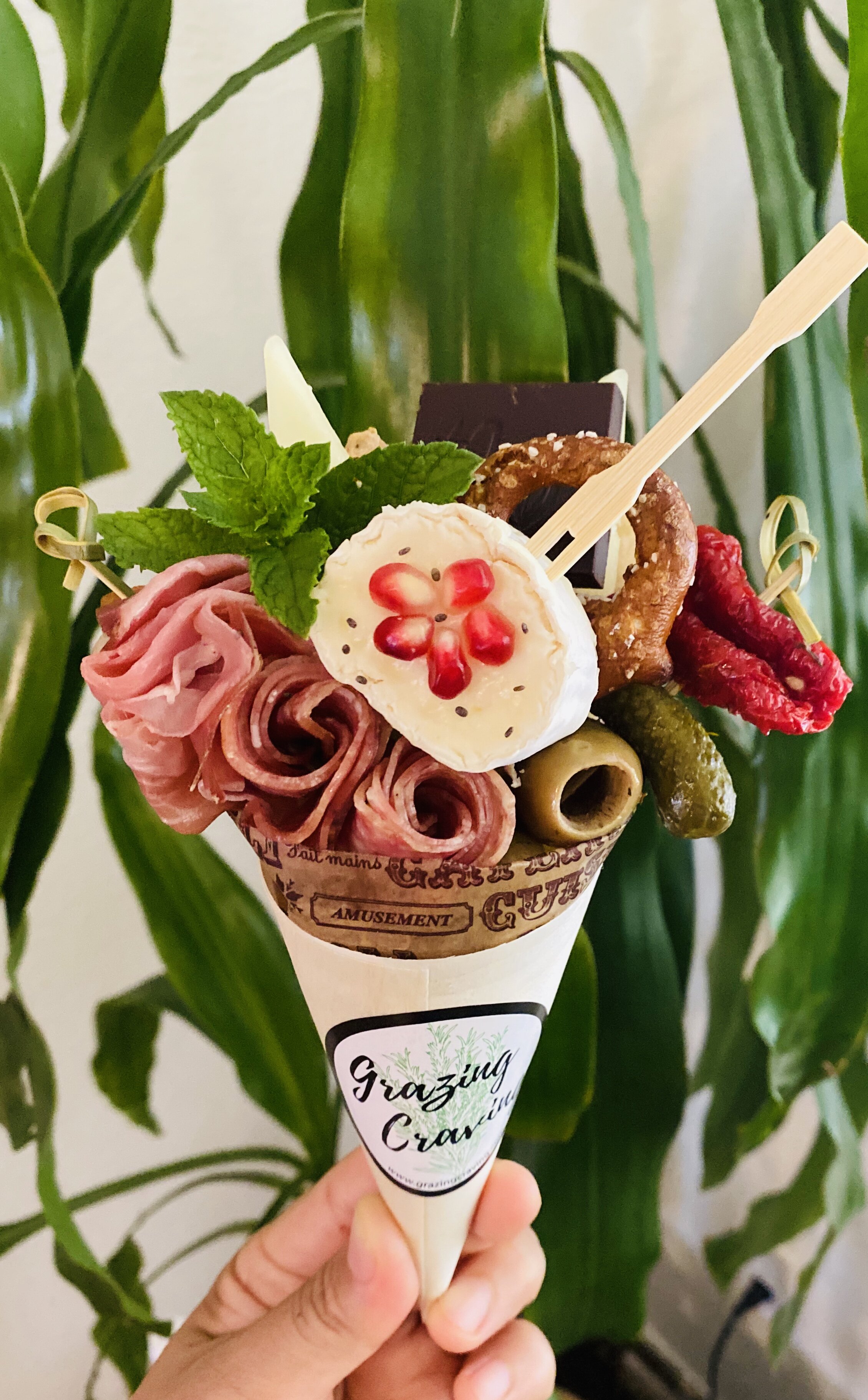 Charcuterie Cone
Grazing Craving’s delectable meats, cheeses, and sweet treats in a single-serve cone.
SQ8379624
charcuterie cone
Grazing Craving