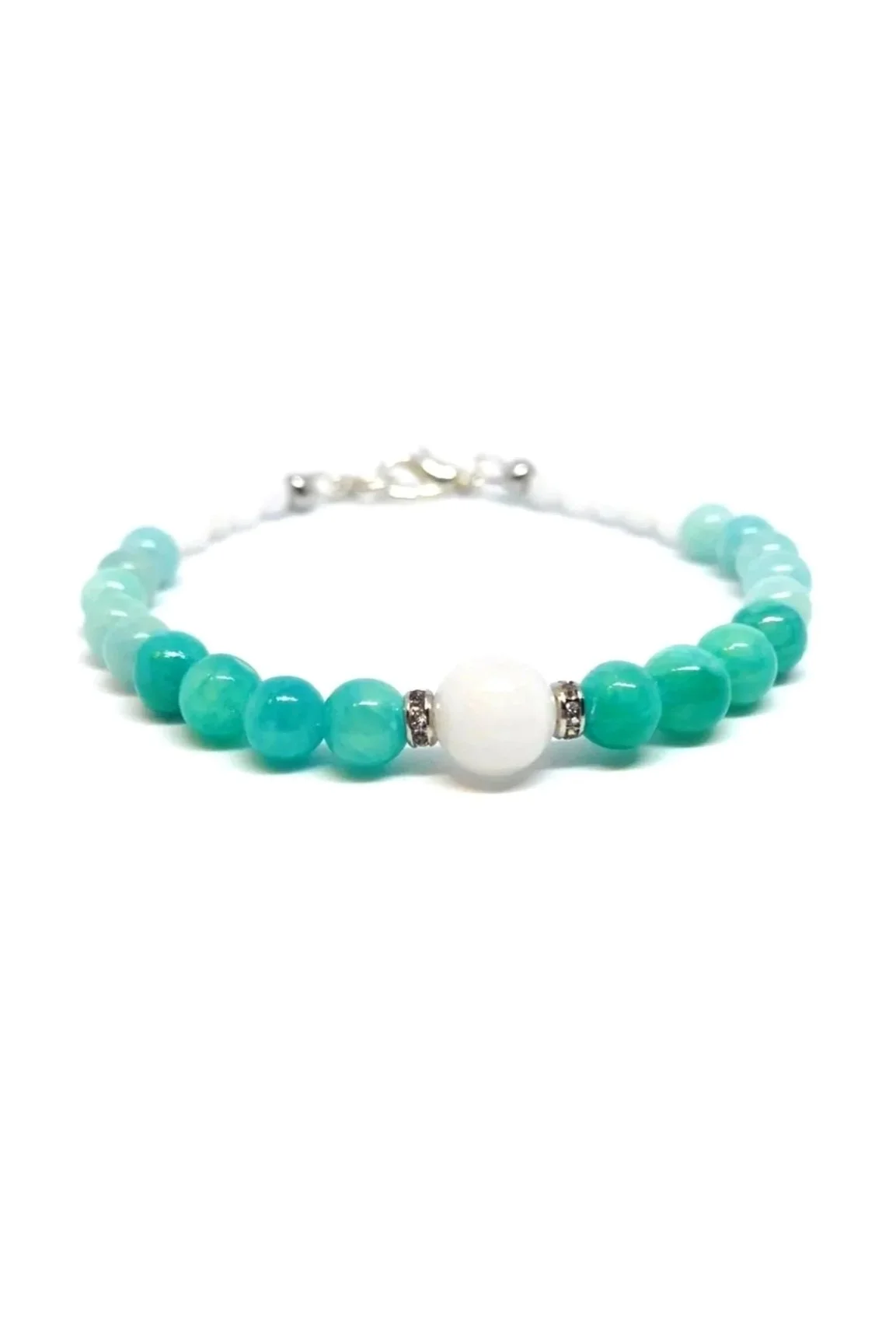 Handmade beaded bracelet featuring 6mm Peruvian Amazonite and Blue Aqua Quartzite beads, centered with an 8mm White Jade bead flanked by silver-toned spacers, on a white background.