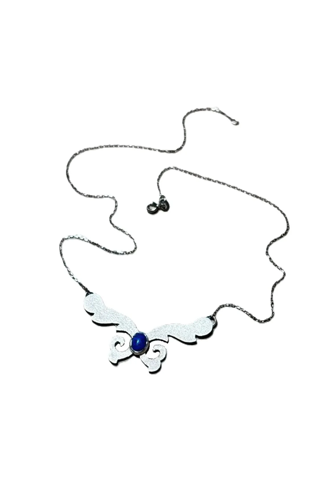 Sterling silver necklace featuring a wing-shaped pendant with an oval gemstone in the center, displayed on a white mannequin bust.