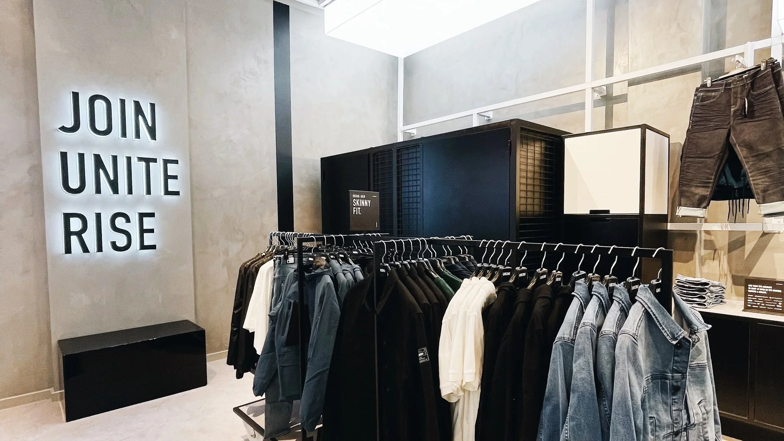 LOOKING TOWARDS FITTING ROOMS