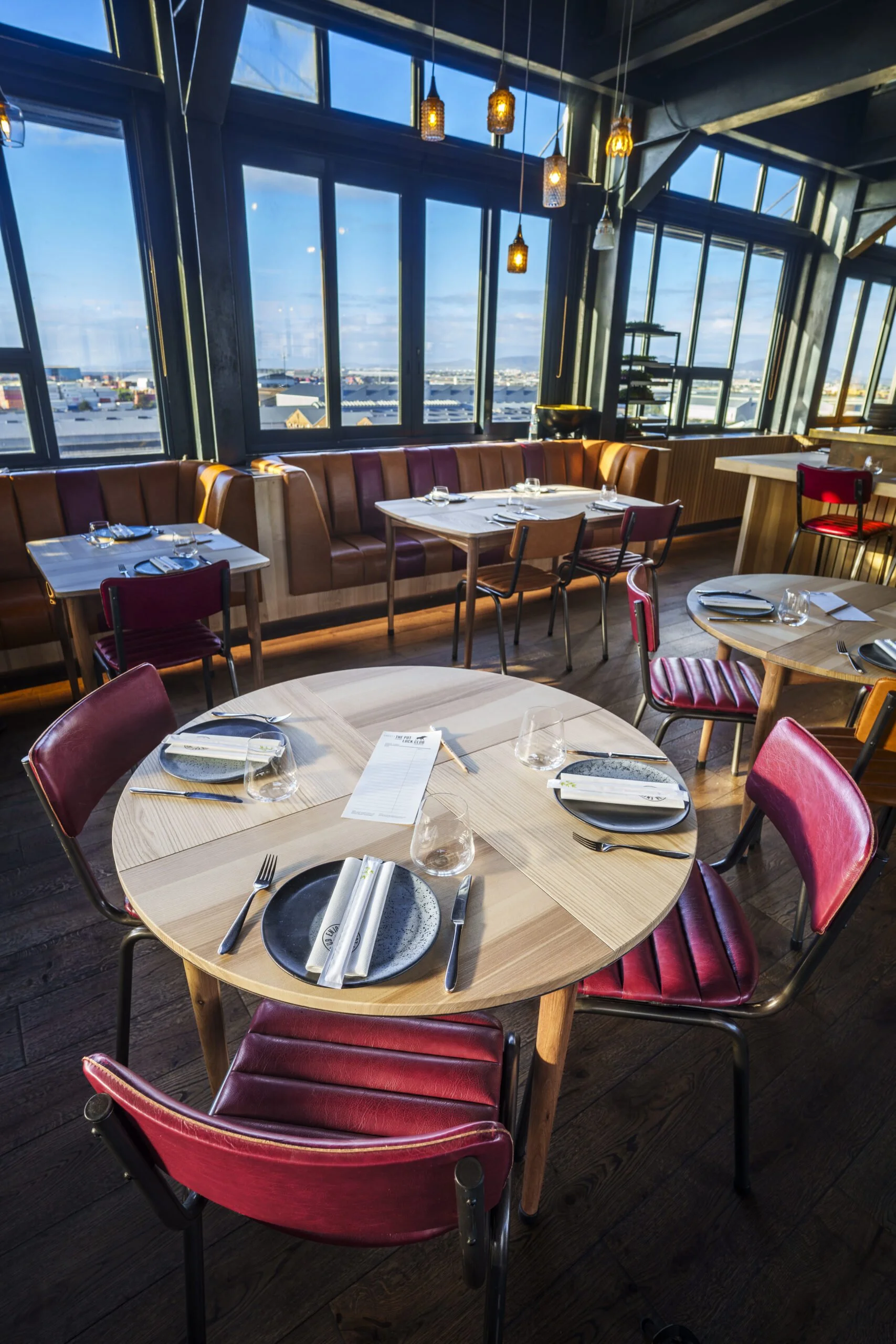 Pot-Luck-club-red-chairs-view--scaled.jpg