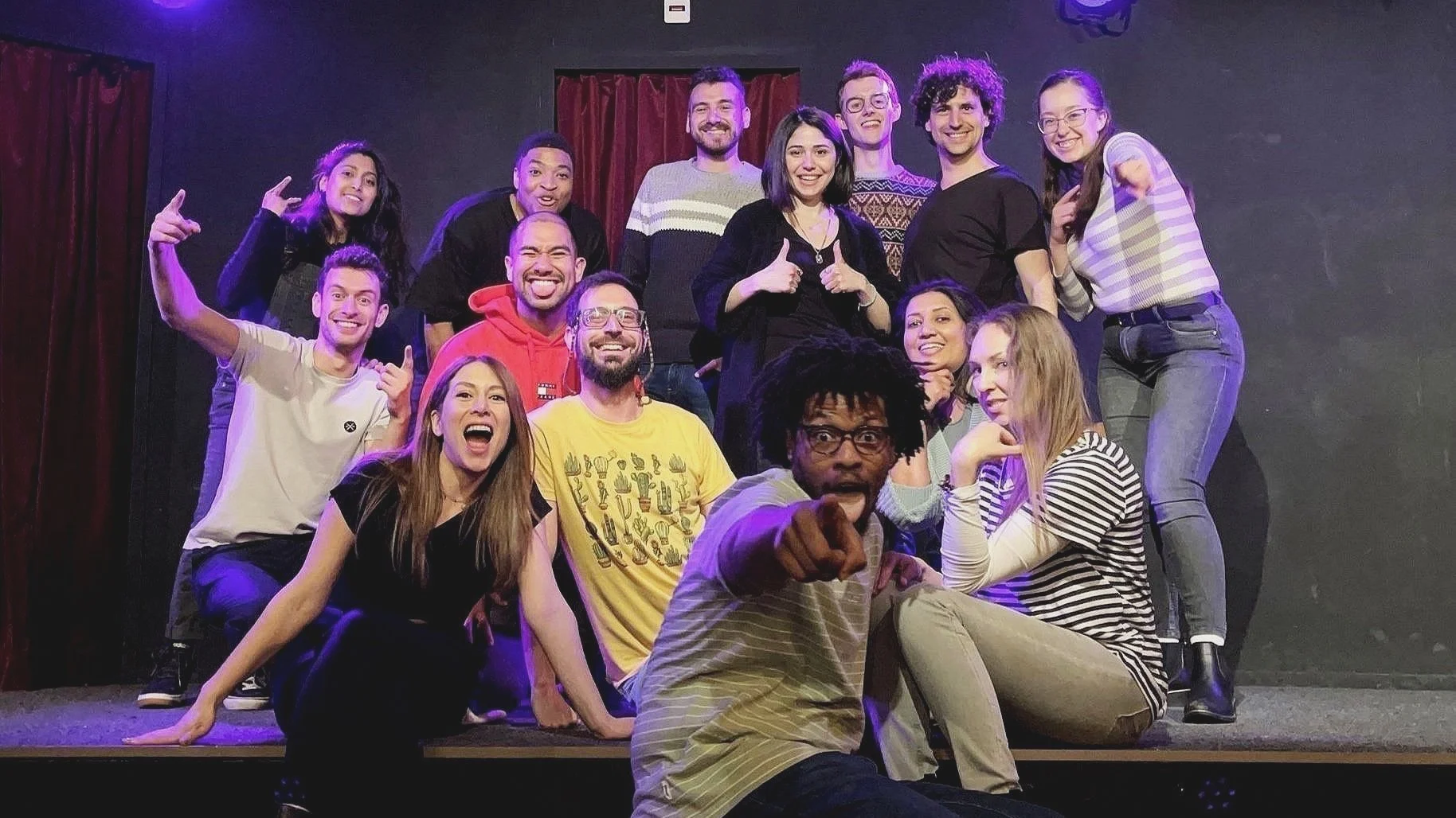 A virtual meeting with nine participants displayed in a grid, each in their own environment.