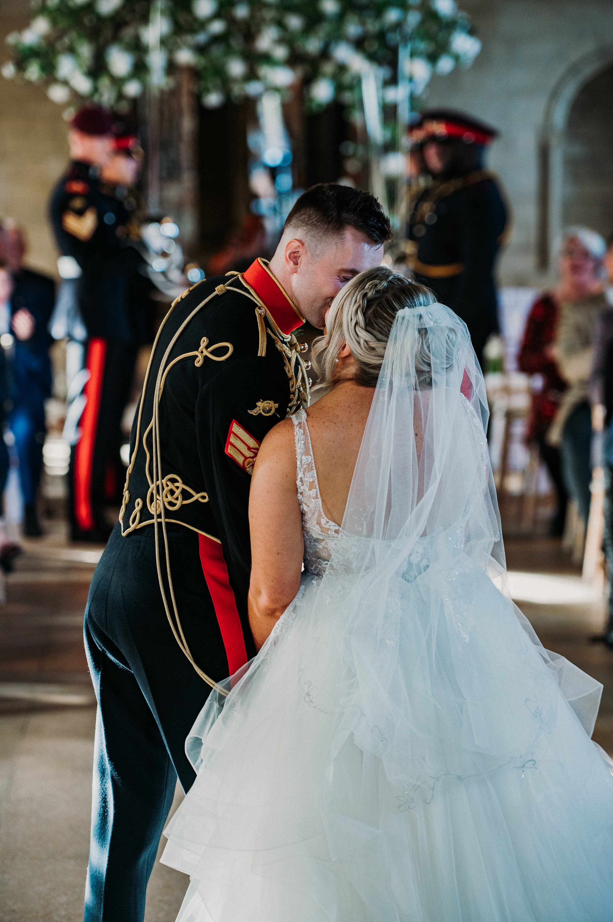 The bride and groom share their first kiss before they walk out of the ceremony room as brand new husband and wife at Sneaton Castle, Whitby.