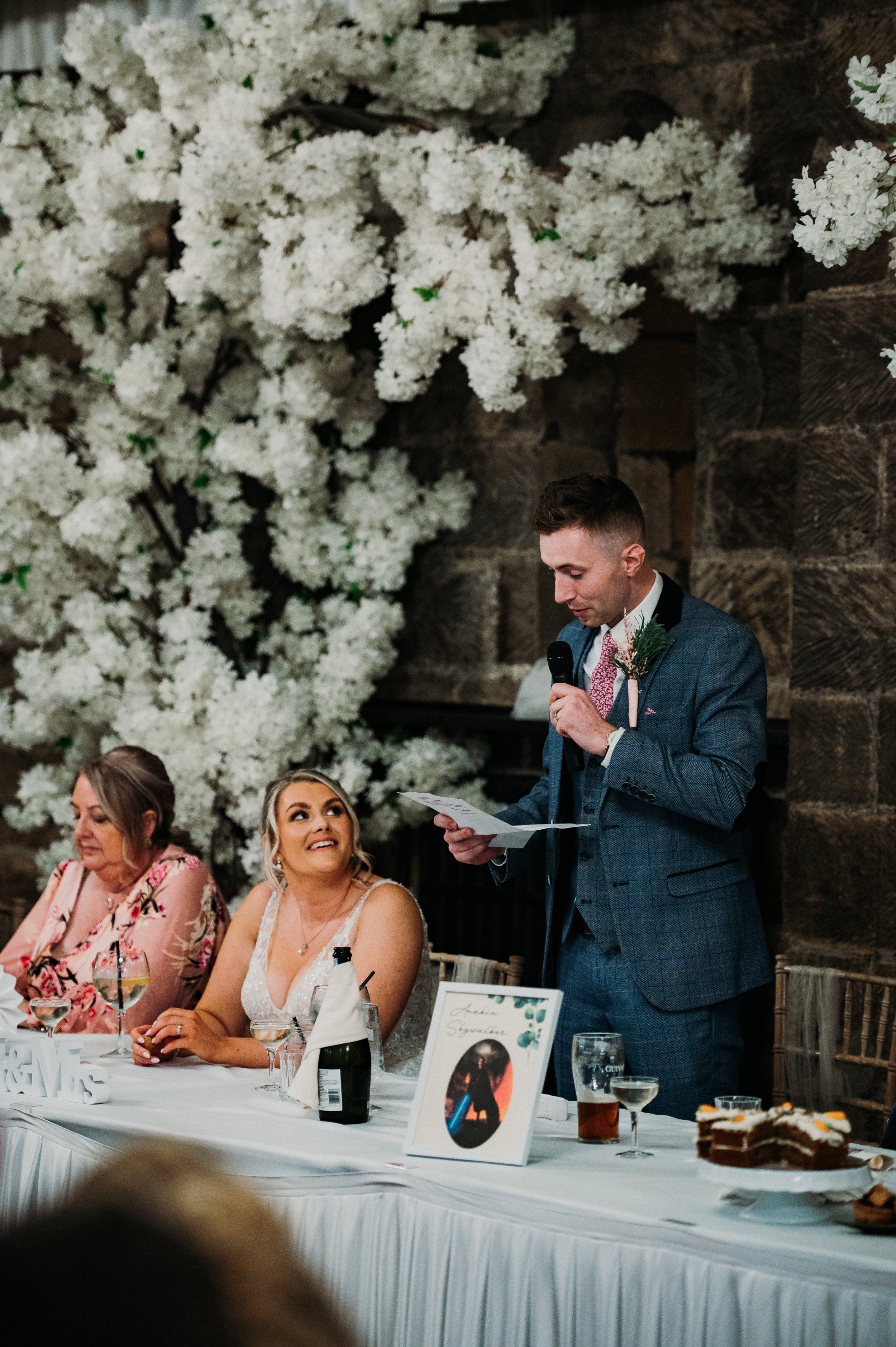 The groom gives his speech after their meal at Sneaton Castle, Whitby.