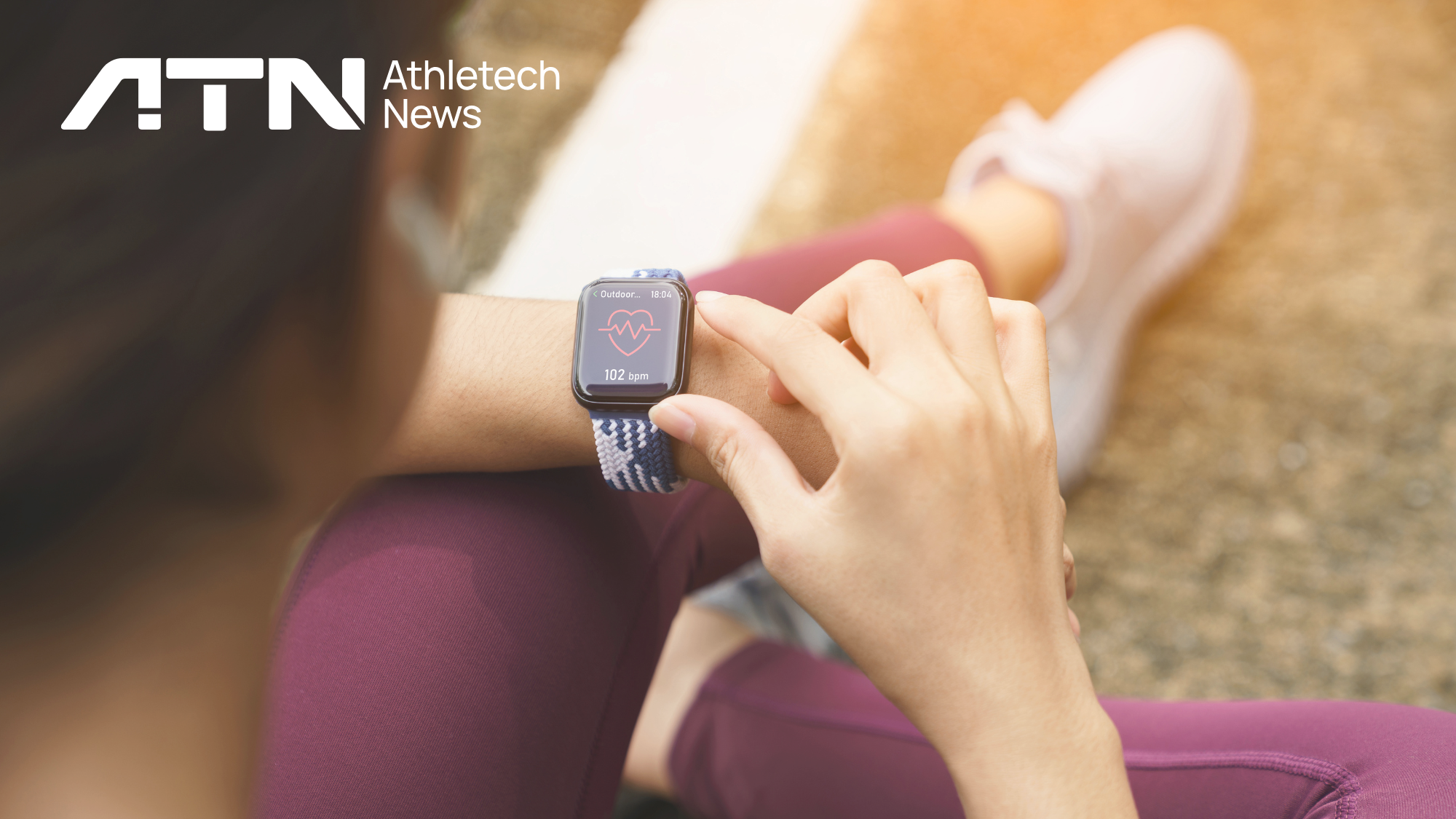 woman checking health analytics on smart watch