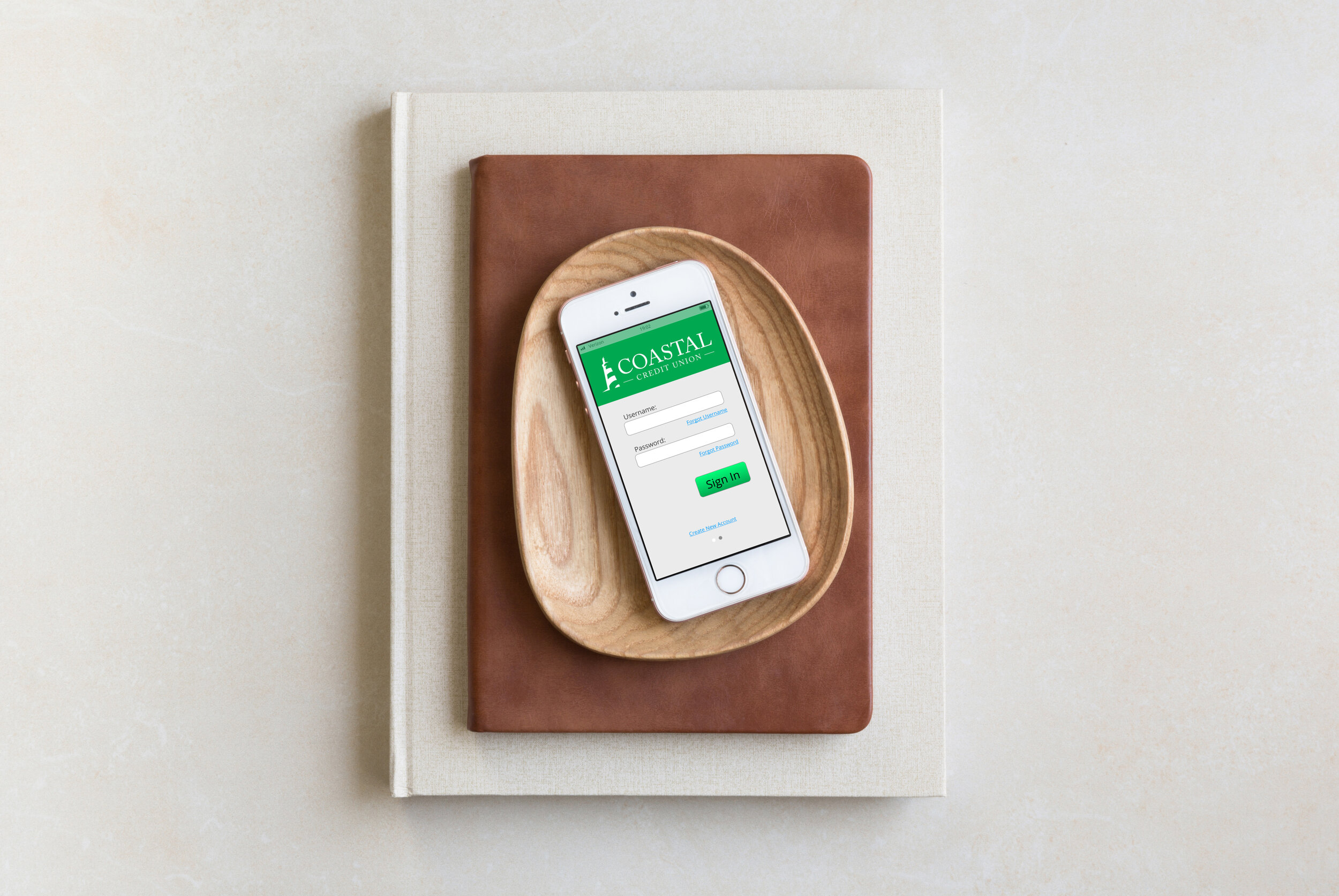 iphone-se-mockup-placed-on-wooden-plate.jpg