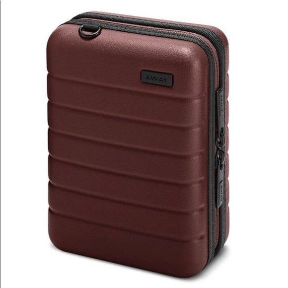 Did I mention...obsessed? This is a mini AWAY case that I use for my makeup. Love.