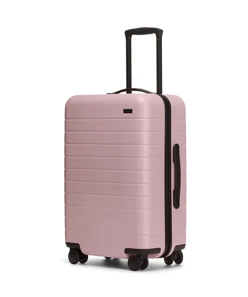 This is Away's "Bigger Carry On" and I just took my first international trip with it. I was able to fit 6 days worth of clothes in it and it fit in the overhead compartment. The wheels on this bad boy are no joke. They handle cobblestone no problem.
