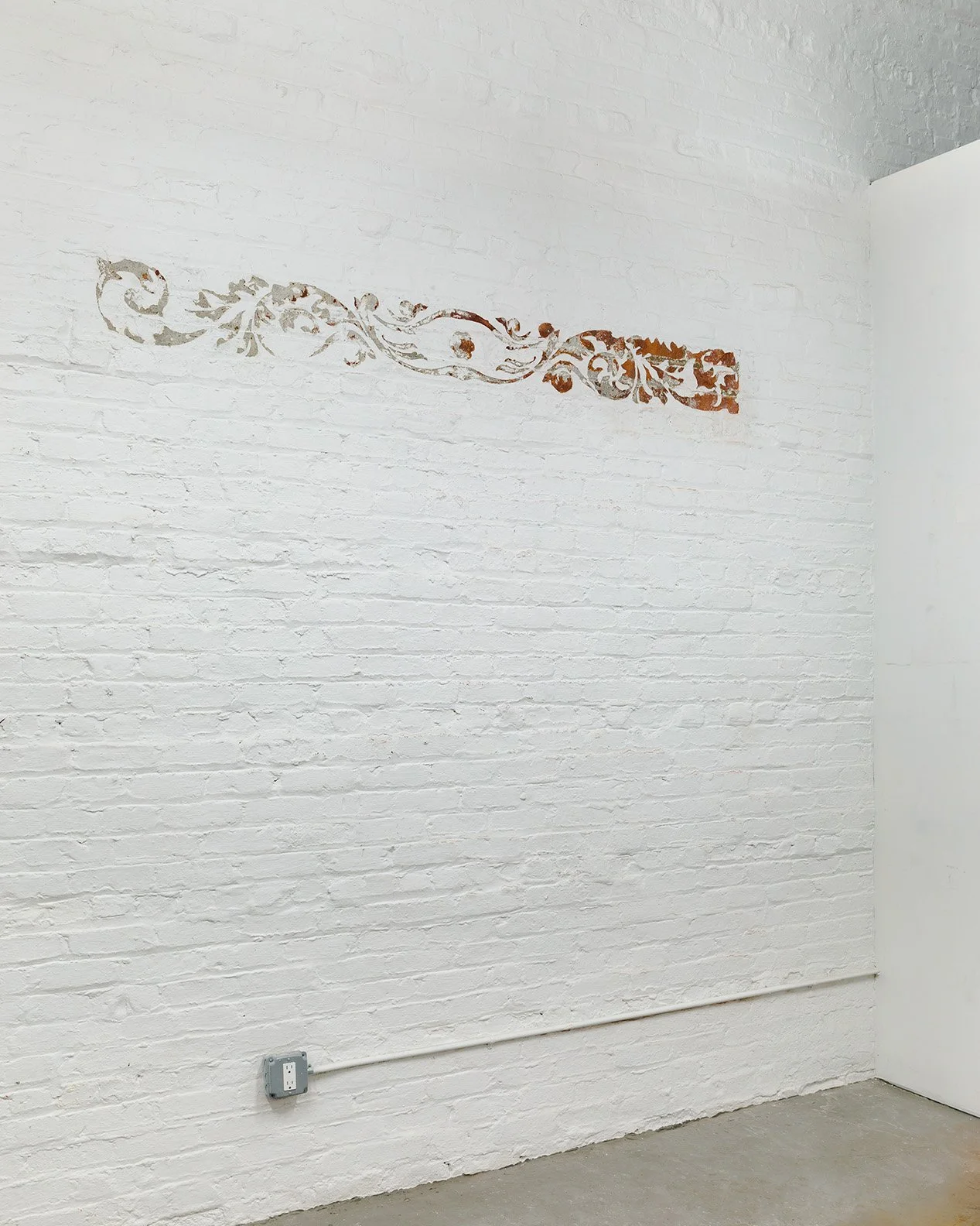 Acanthus Lintel. Scraped paint on existing wall. 2020