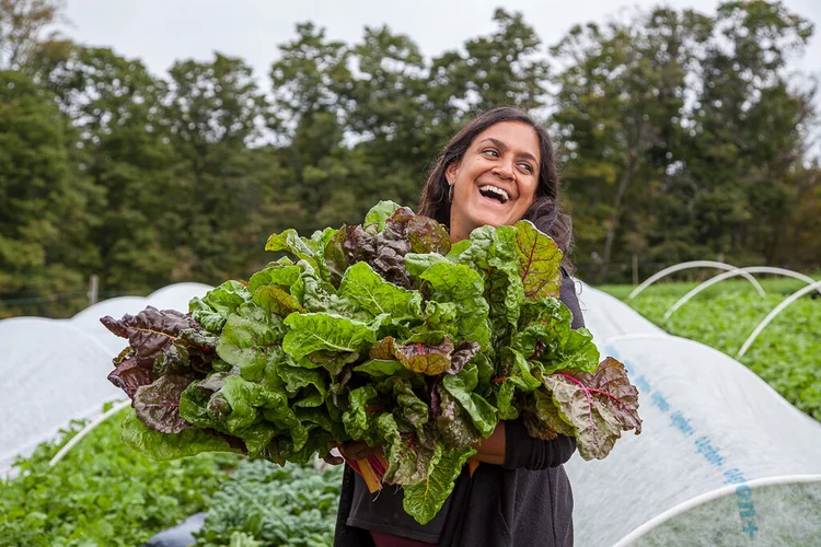 Jen Salinetti holding a bunch or greens