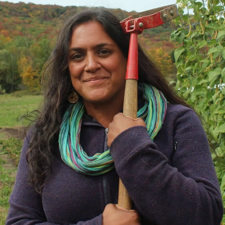 Jen Salinetti holding a rake
