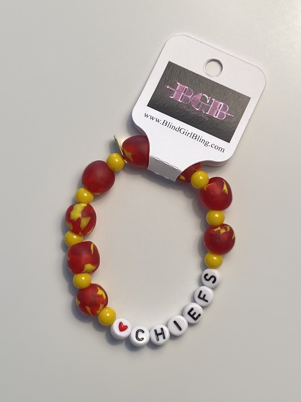 10mm red and yellow African recycled glass fused beads with gold, silver or yellow spacer beads.