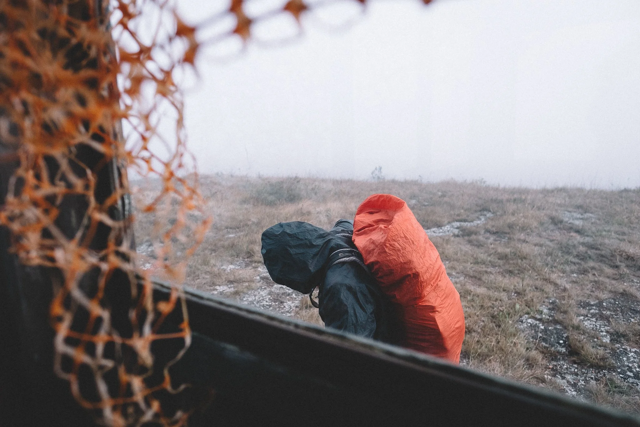 Júlio preparing to trek during a storm atop the Chapada do Couto, Rio Preto State Park